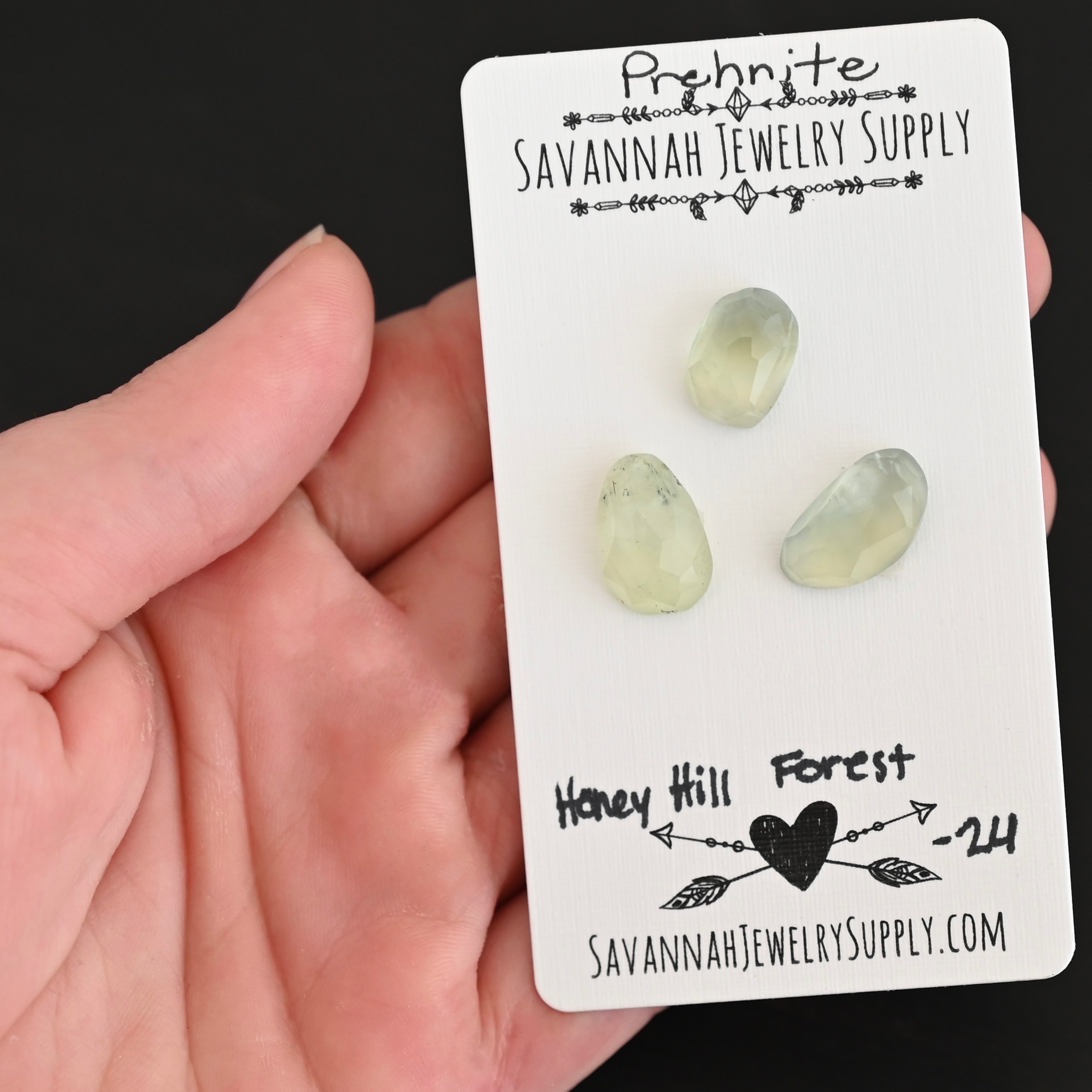 Honey Hill Forest Rose Cut Prehnite Cabochon Parcel shown in hand