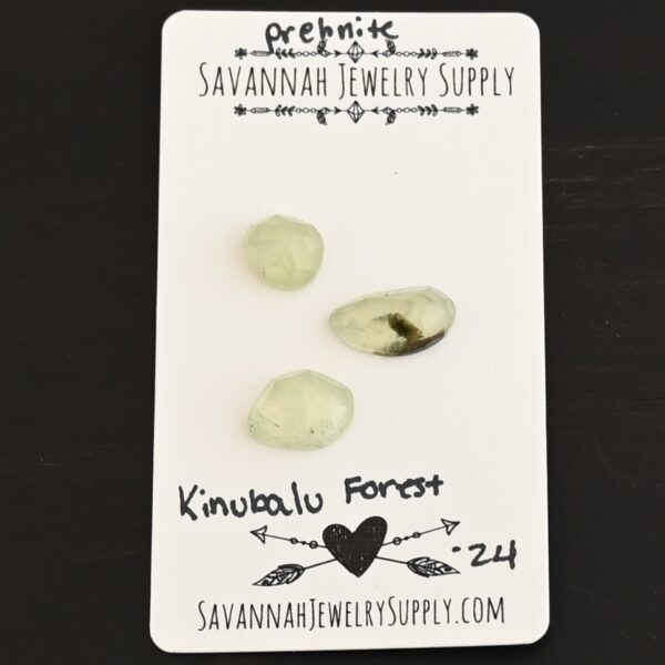 Kinabalu Forest Rose Cut Prehnite Cabochon Parcel shown on business card