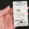Lacadon Jungle Rose Cut Prehnite Cabochon Parcel shown in hand