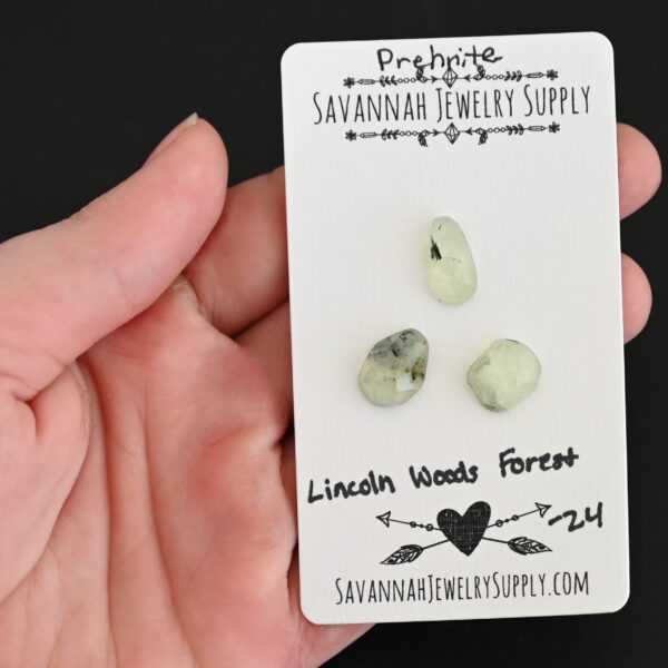 Lincoln Woods Forest Rose Cut Prehnite Cabochon Parcel shown in hand