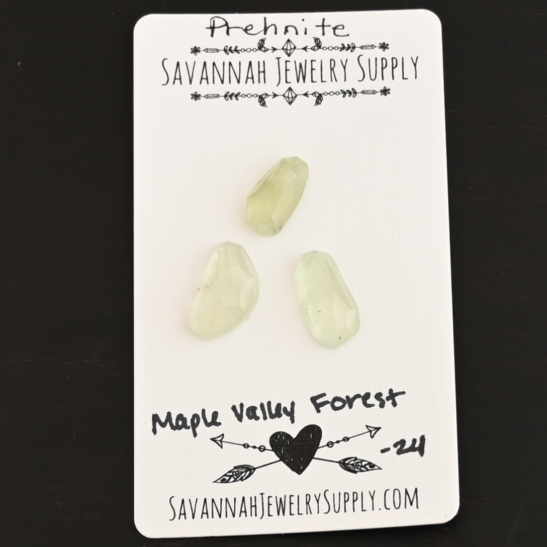 Maple Valley Forest Rose Cut Prehnite Cabochon Parcel shown on business card