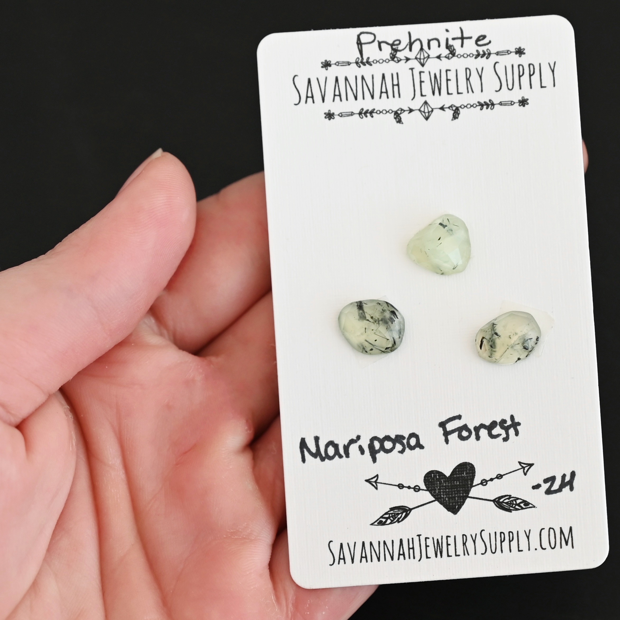 Mariposa Forest Rose Cut Prehnite Cabochon Parcel shown in hand