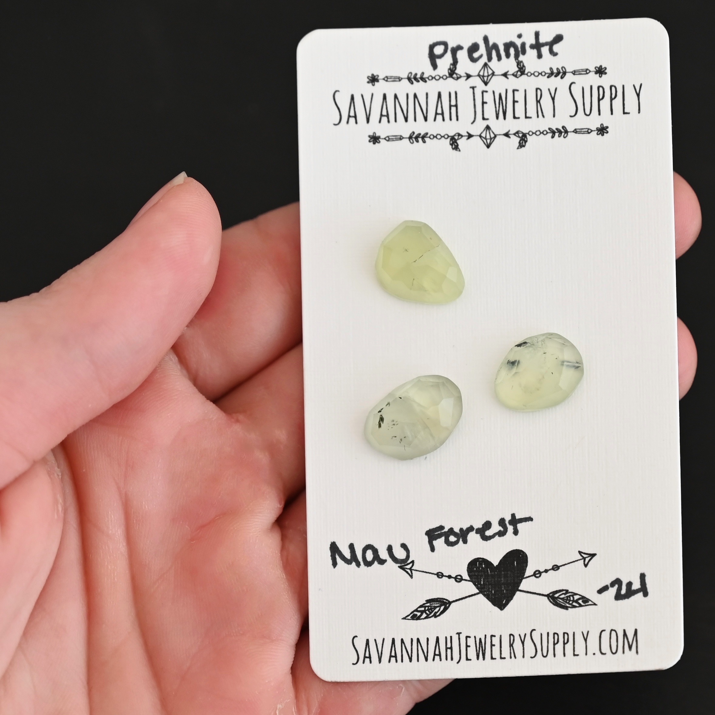 Mau Forest Rose Cut Prehnite Cabochon Parcel shown in hand