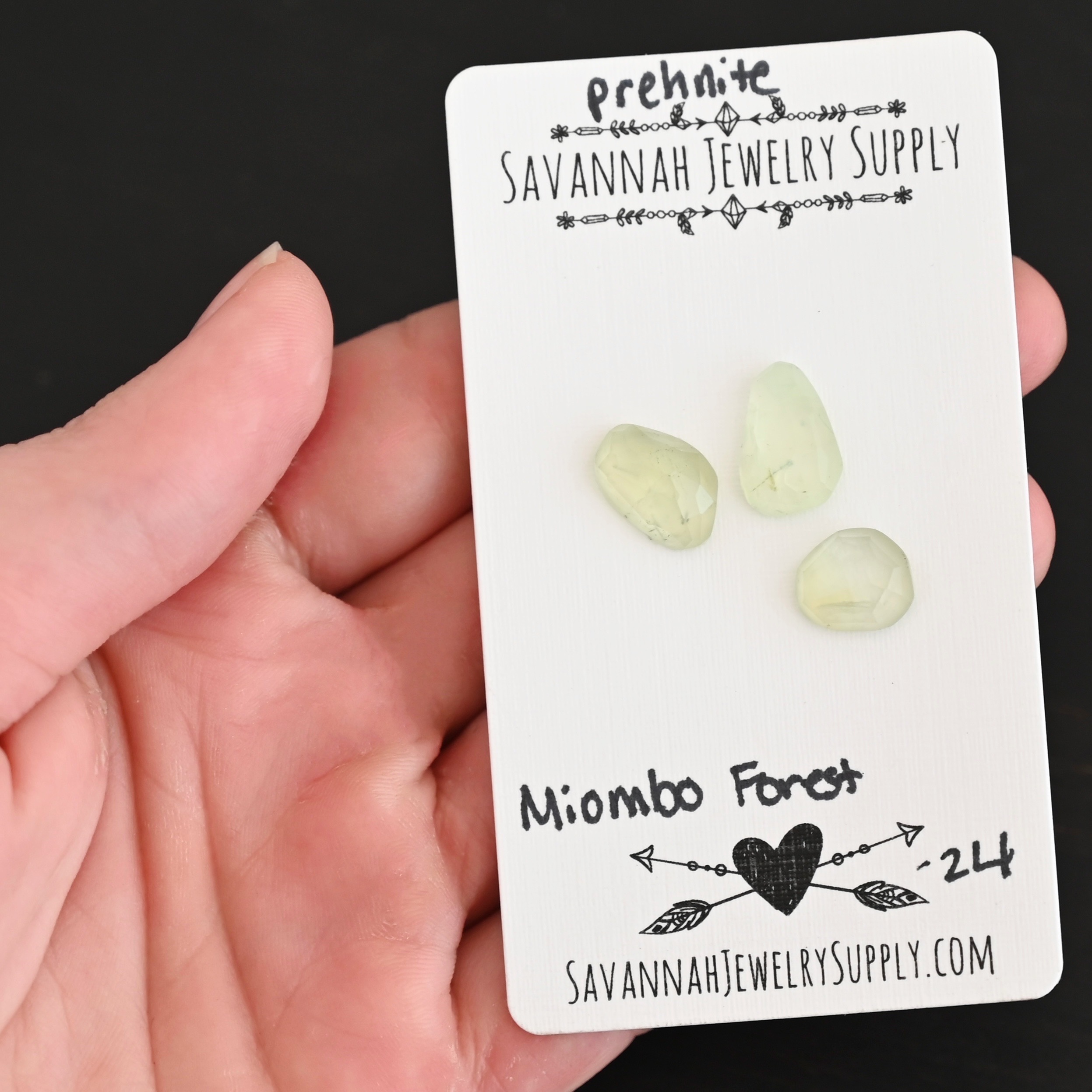 Miombo Forest Rose Cut Prehnite Cabochon Parcel shown in hand