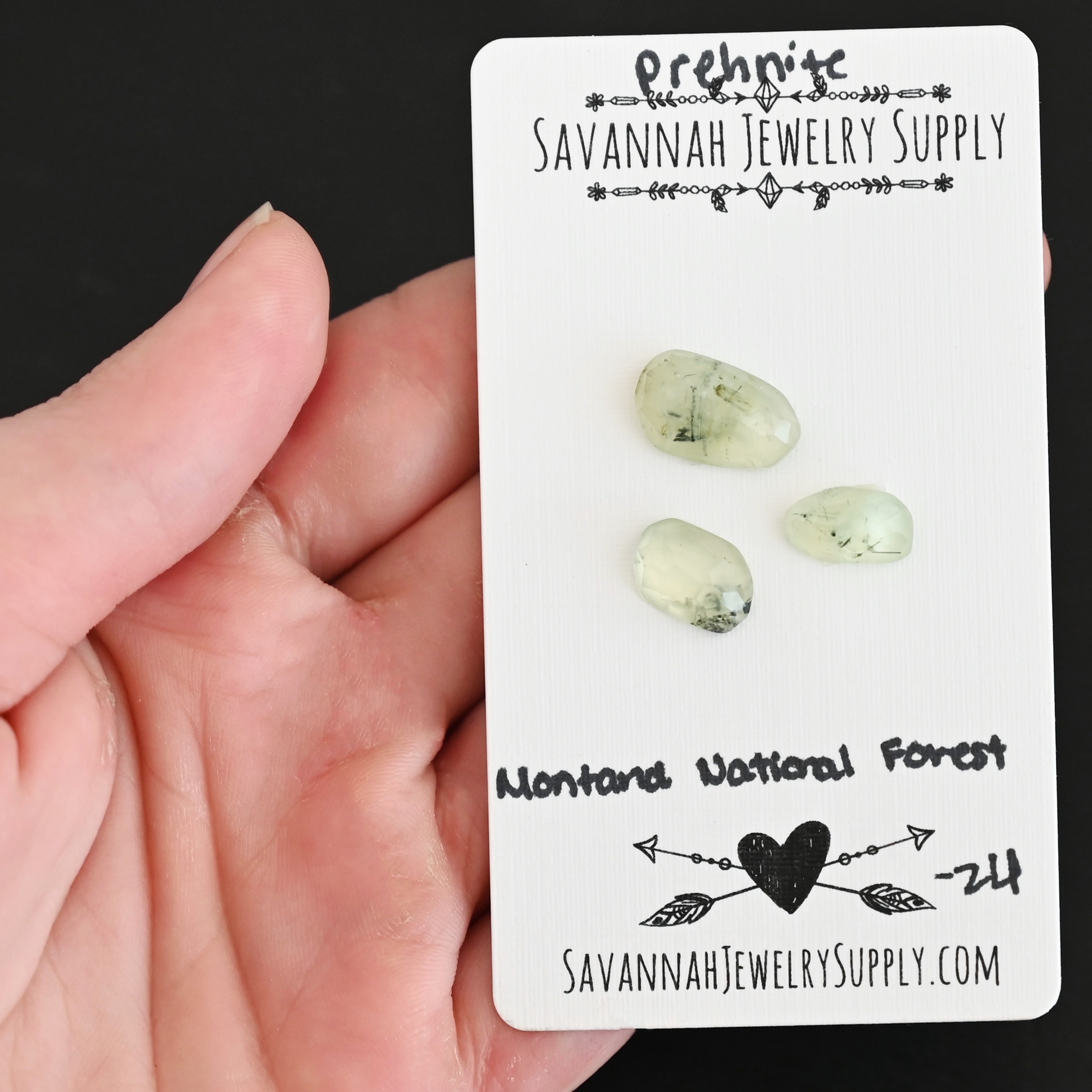 Montana National Forest Rose Cut Prehnite Cabochon Parcel shown in hand