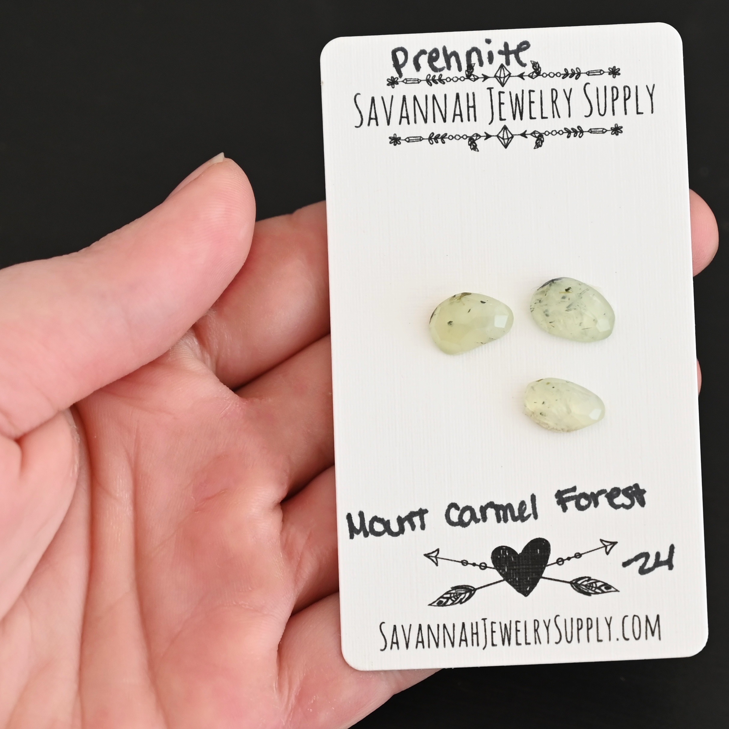 Mount Carmel Forest Rose Cut Prehnite Cabochon Parcel shown in hand