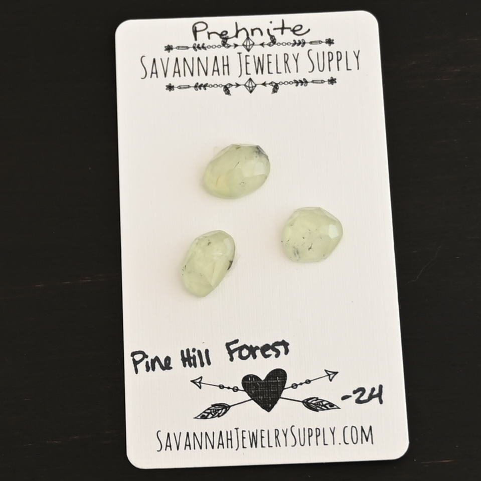 Pine Hill Forest Rose Cut Prehnite Cabochon Parcel shown on business card