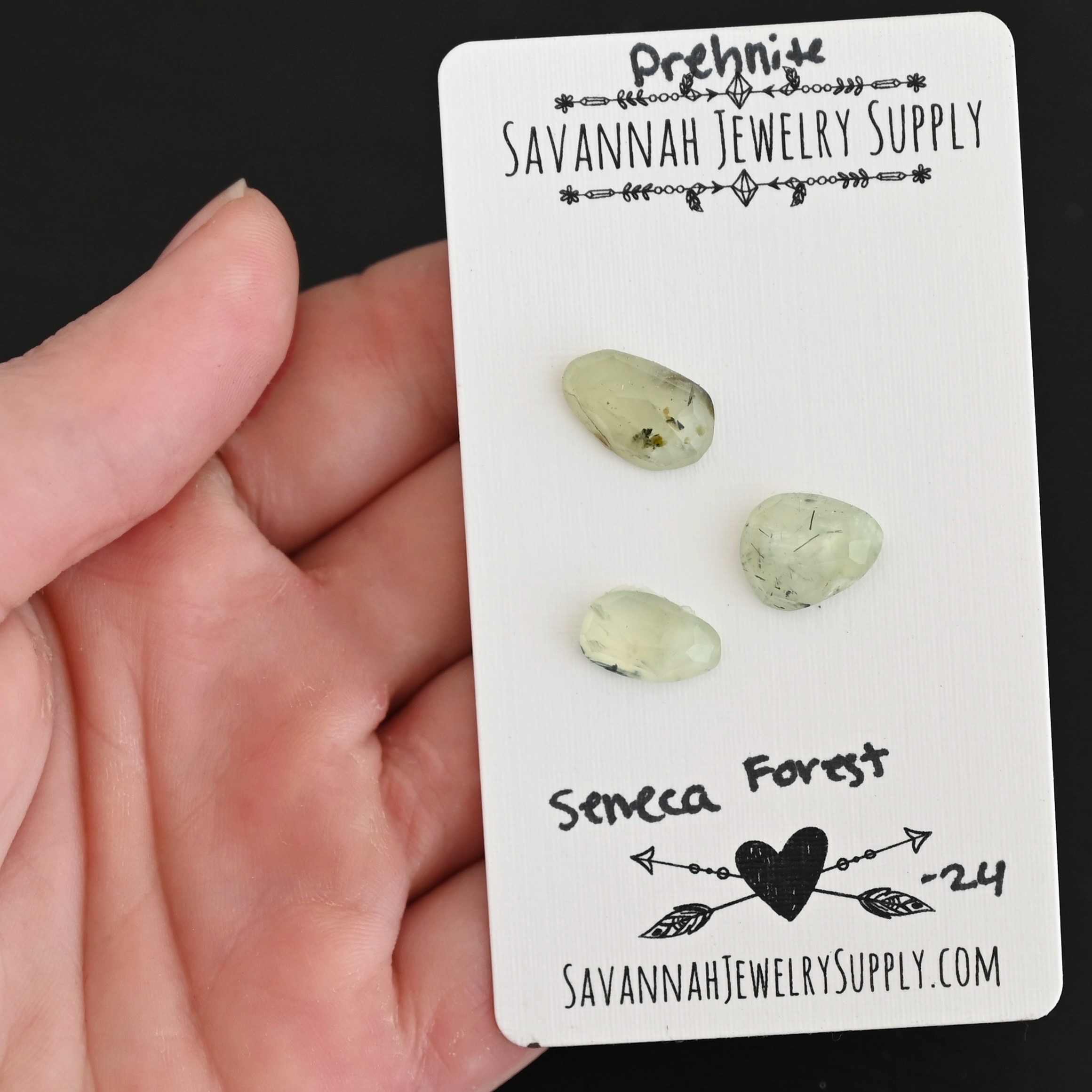 Seneca Forest Rose Cut Prehnite Cabochon Parcel shown in hand