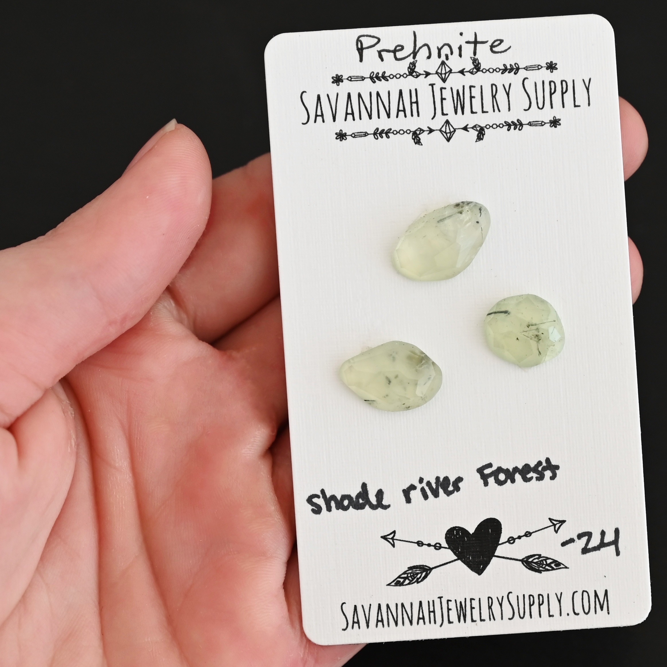 Shade River Forest Rose Cut Prehnite Cabochon Parcel shown in hand