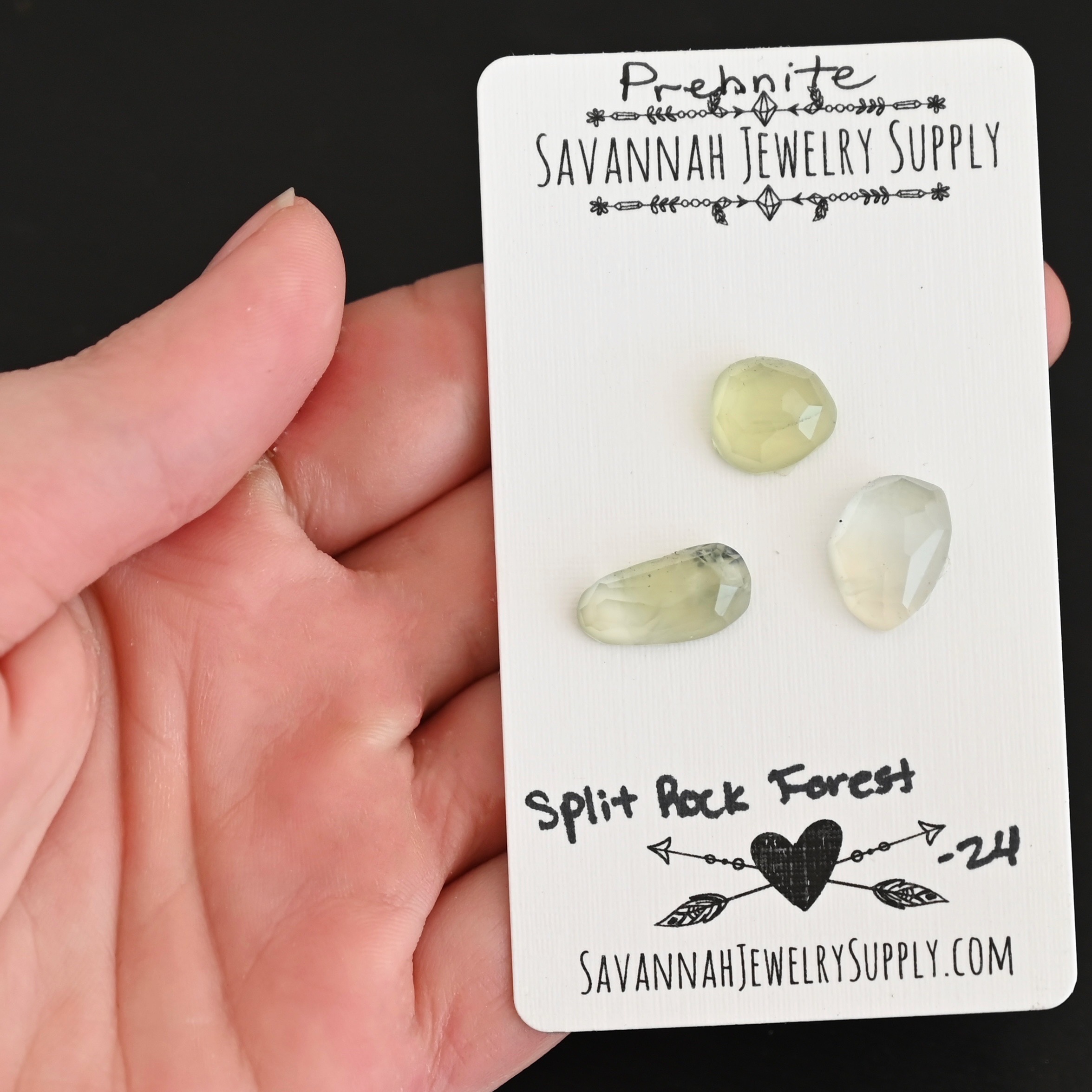 Split Rock Forest Rose Cut Prehnite Cabochon Parcel shown in hand