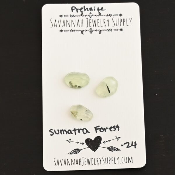 Sumatra Forest Rose Cut Prehnite Cabochon Parcel shown on business card
