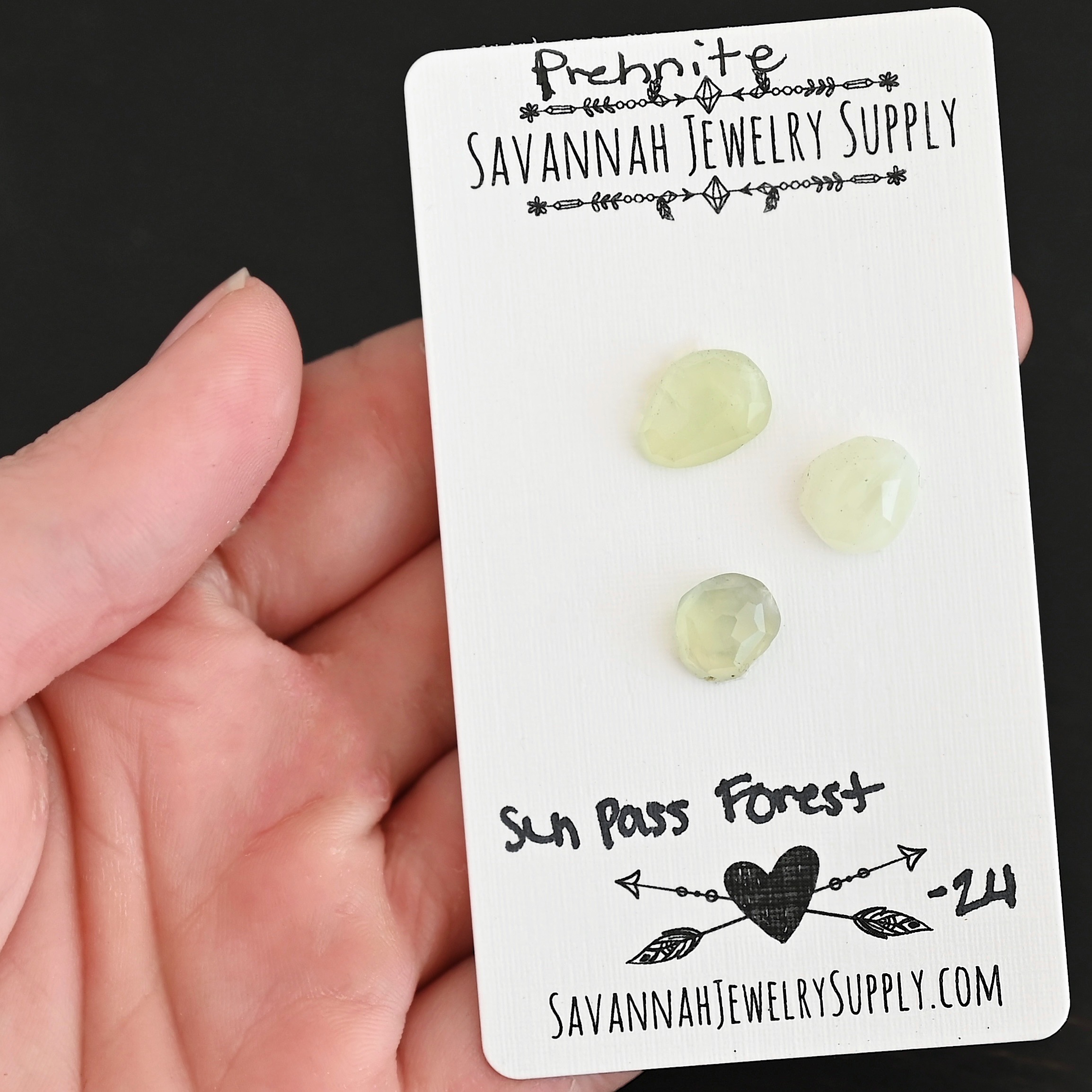 Sun Pass Forest Rose Cut Prehnite Cabochon Parcel shown in hand