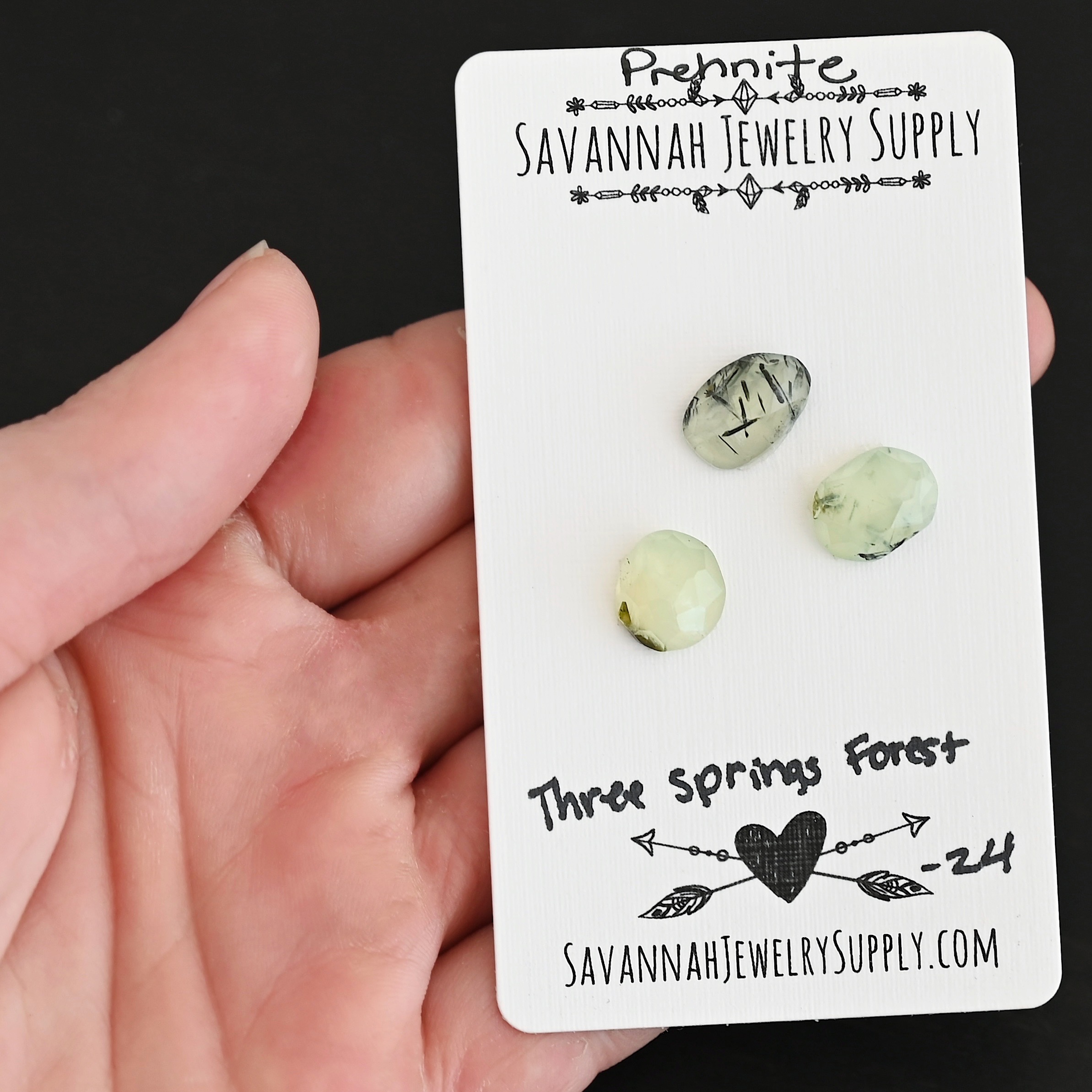 Three Springs Forest Rose Cut Prehnite Cabochon Parcel shown in hand