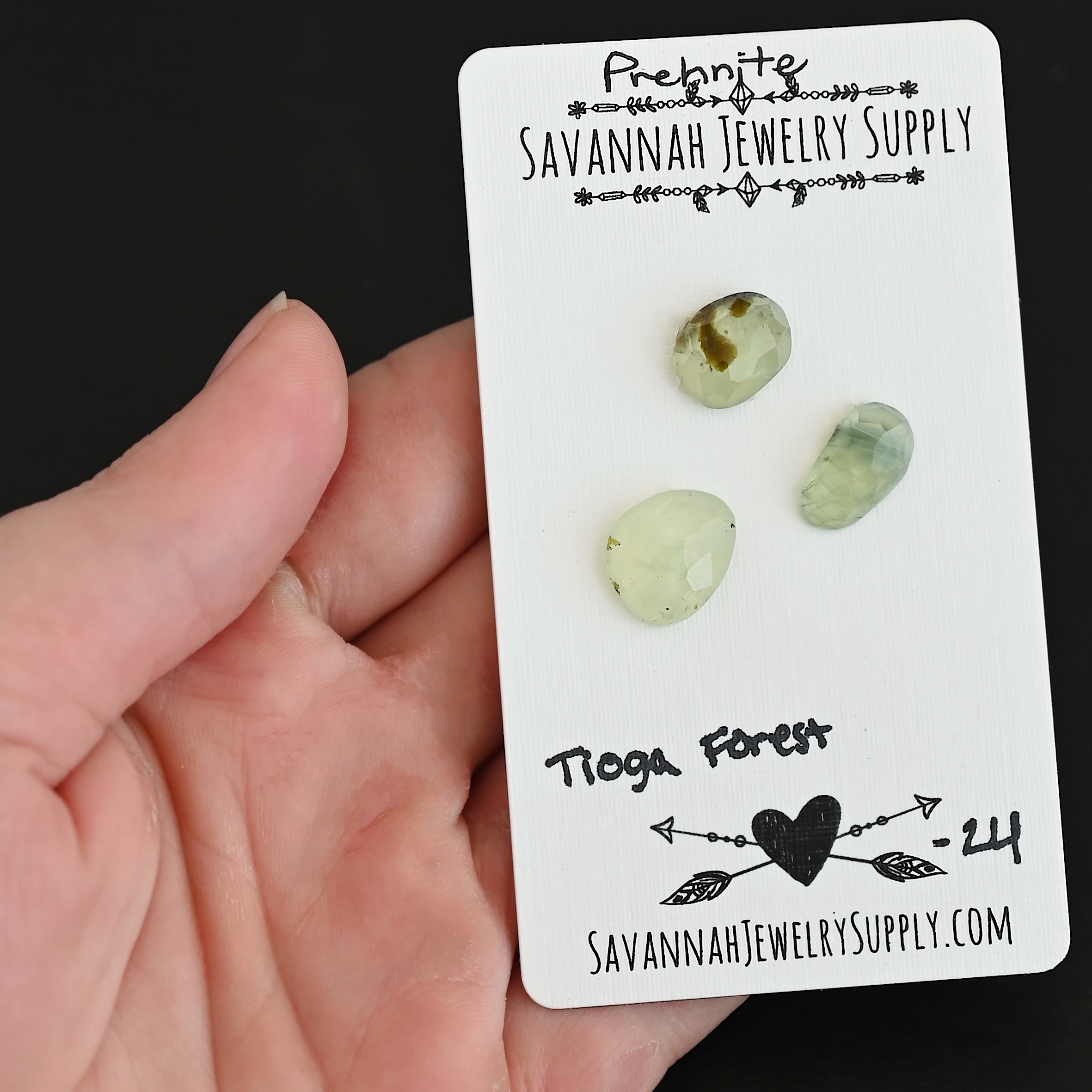Tioga Forest Rose Cut Prehnite Cabochon Parcel shown in hand