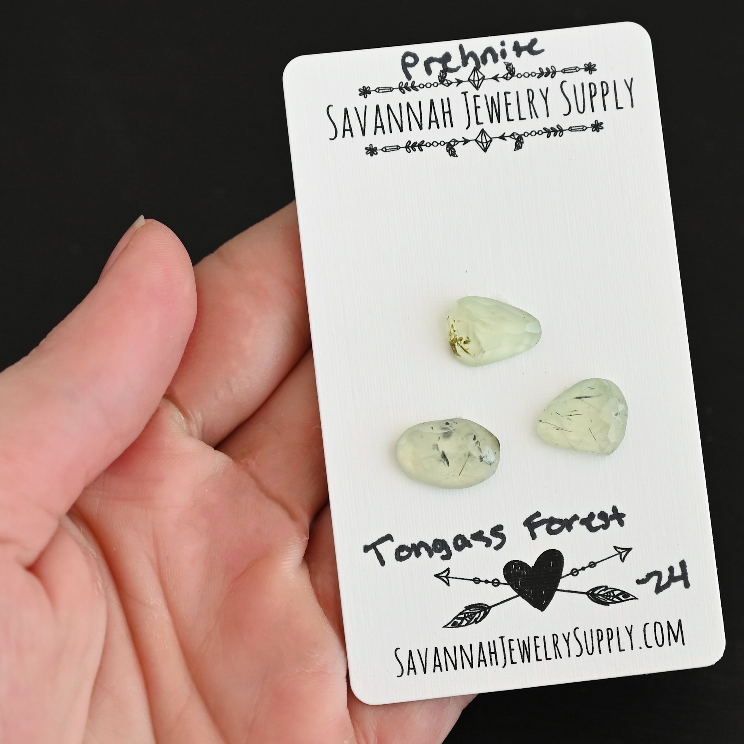 Tongass Forest Rose Cut Prehnite Cabochon Parcel shown in hand