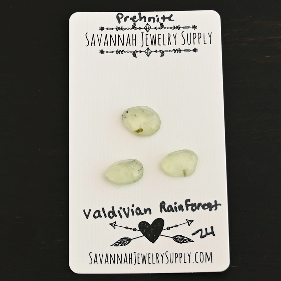 Valdivian Forest Rose Cut Prehnite Cabochon Parcel shown on business card