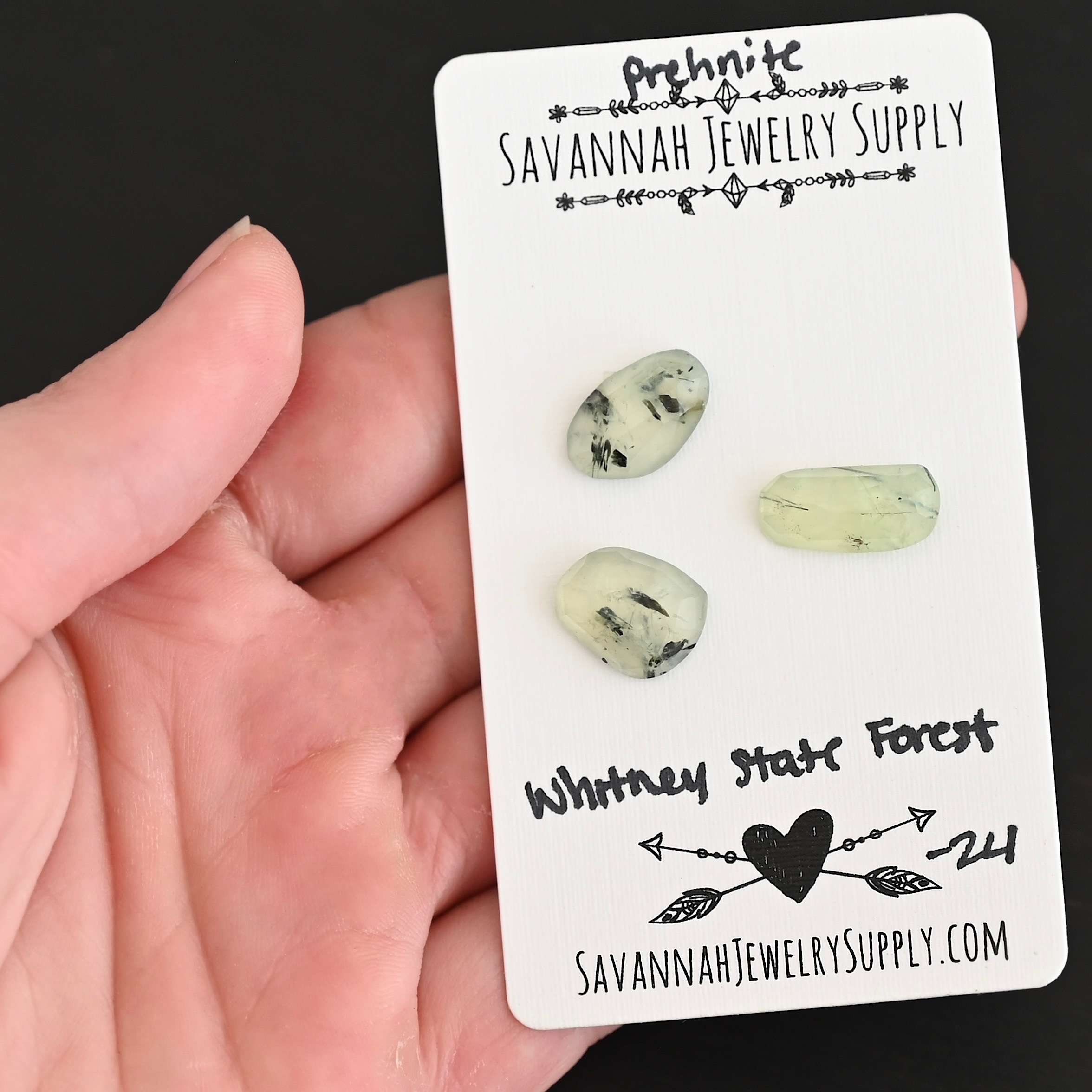 Whitney State Forest Rose Cut Prehnite Cabochon Parcel shown in hand