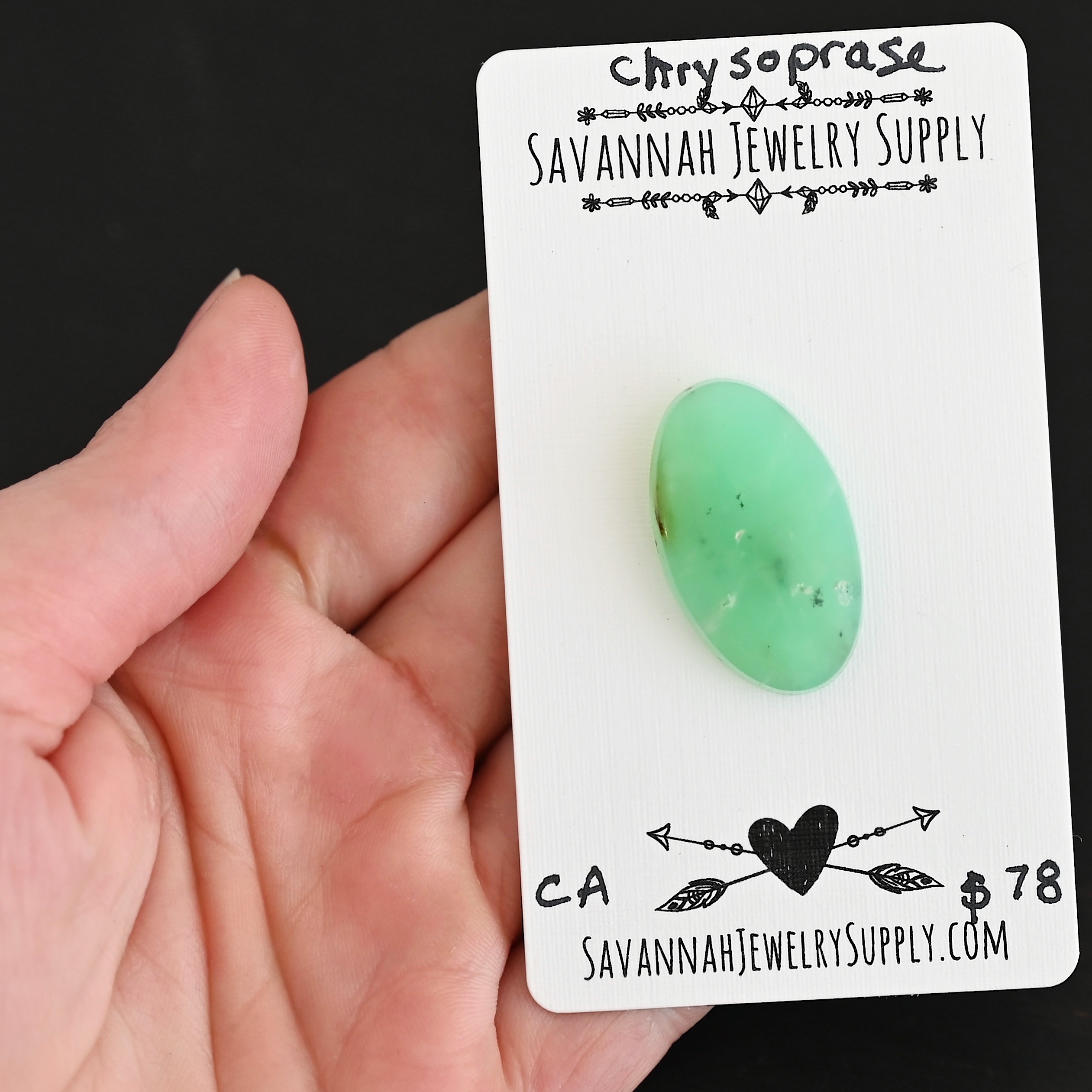 CA Chrysoprase Cabochon Parcel shown in hand