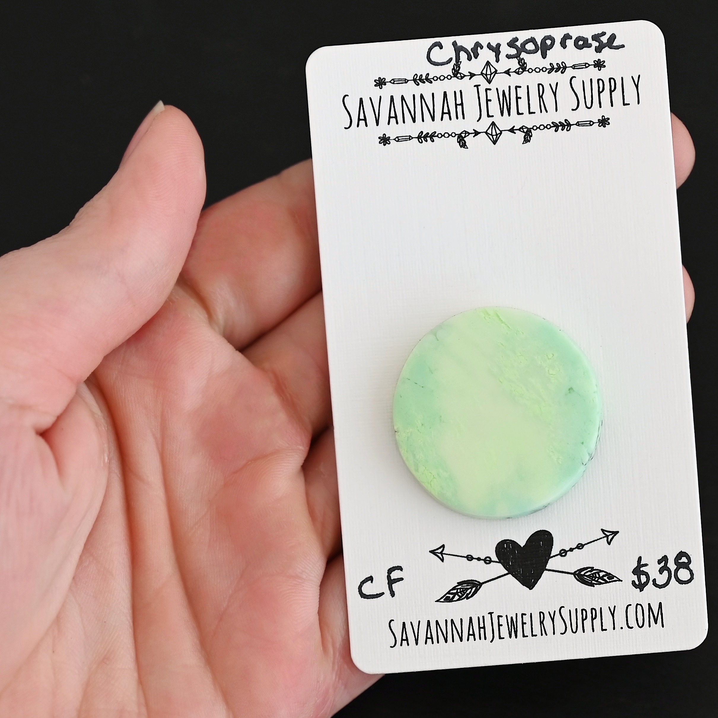 CF Chrysoprase Cabochon Parcel shown in hand