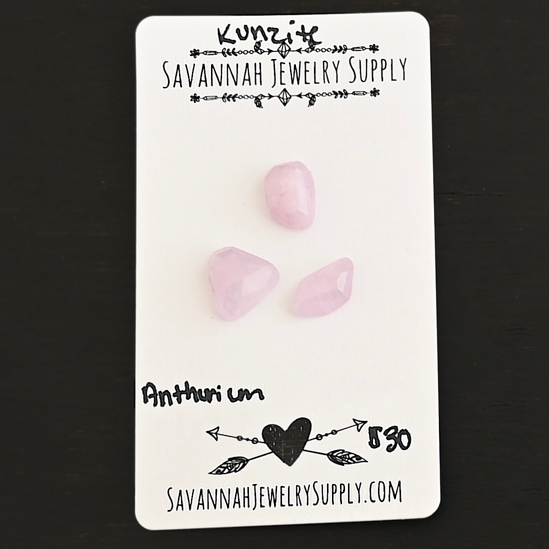 Anthurium Rose Cut Kunzite Cabochon Parcel shown on business card