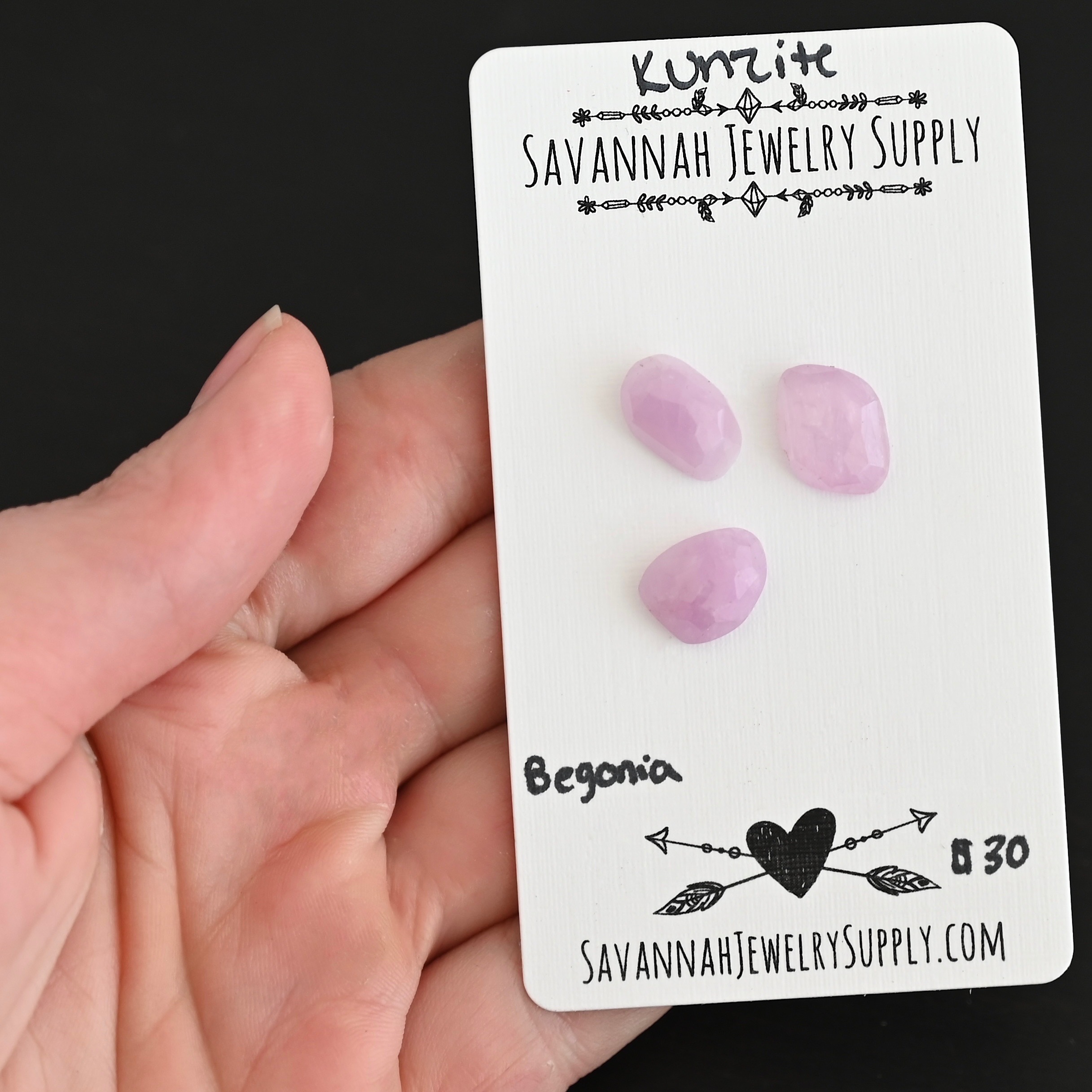 Begonia Rose Cut Kunzite Cabochon Parcel shown in hand