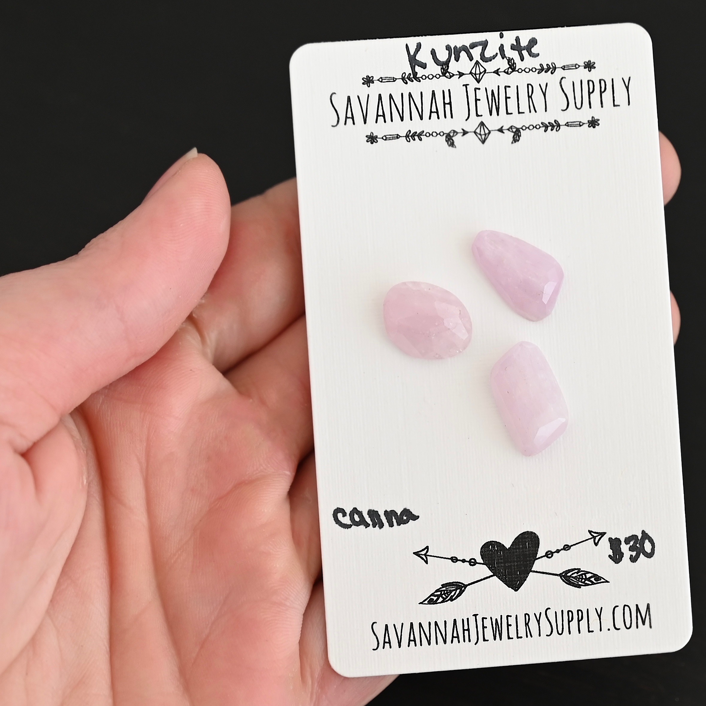 Canna Rose Cut Kunzite Cabochon Parcel shown in hand