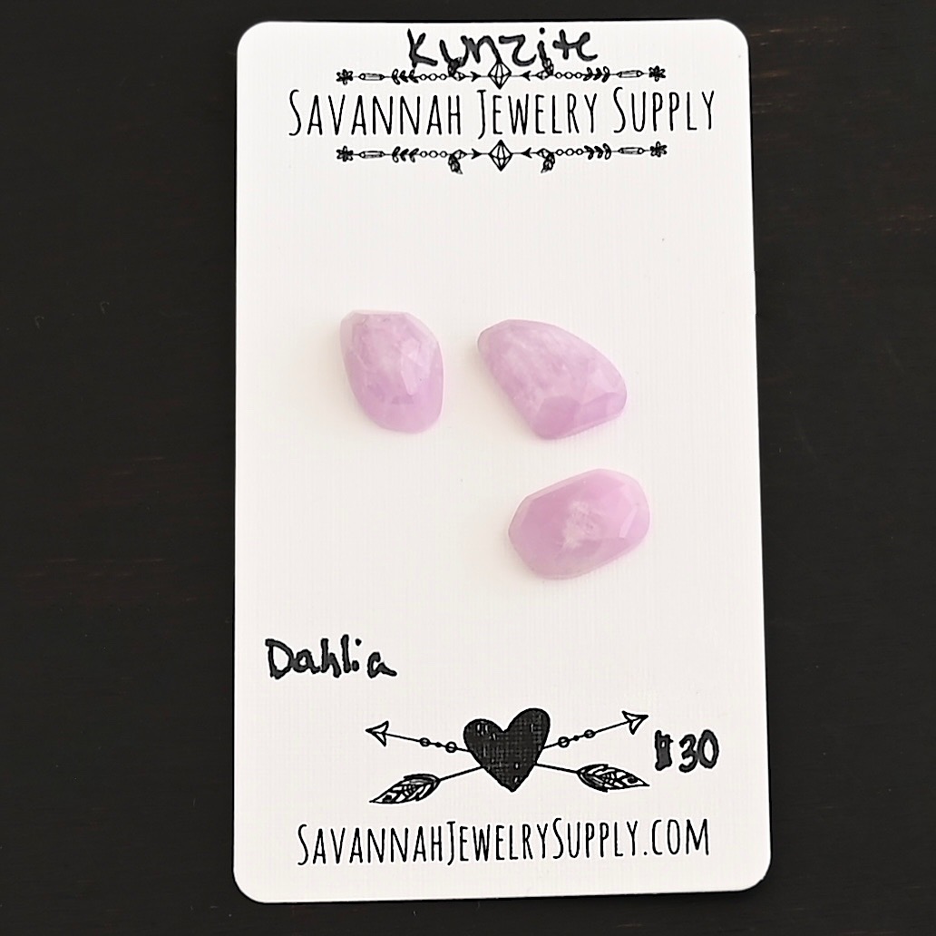 Dahlia Rose Cut Kunzite Cabochon Parcel shown on business card