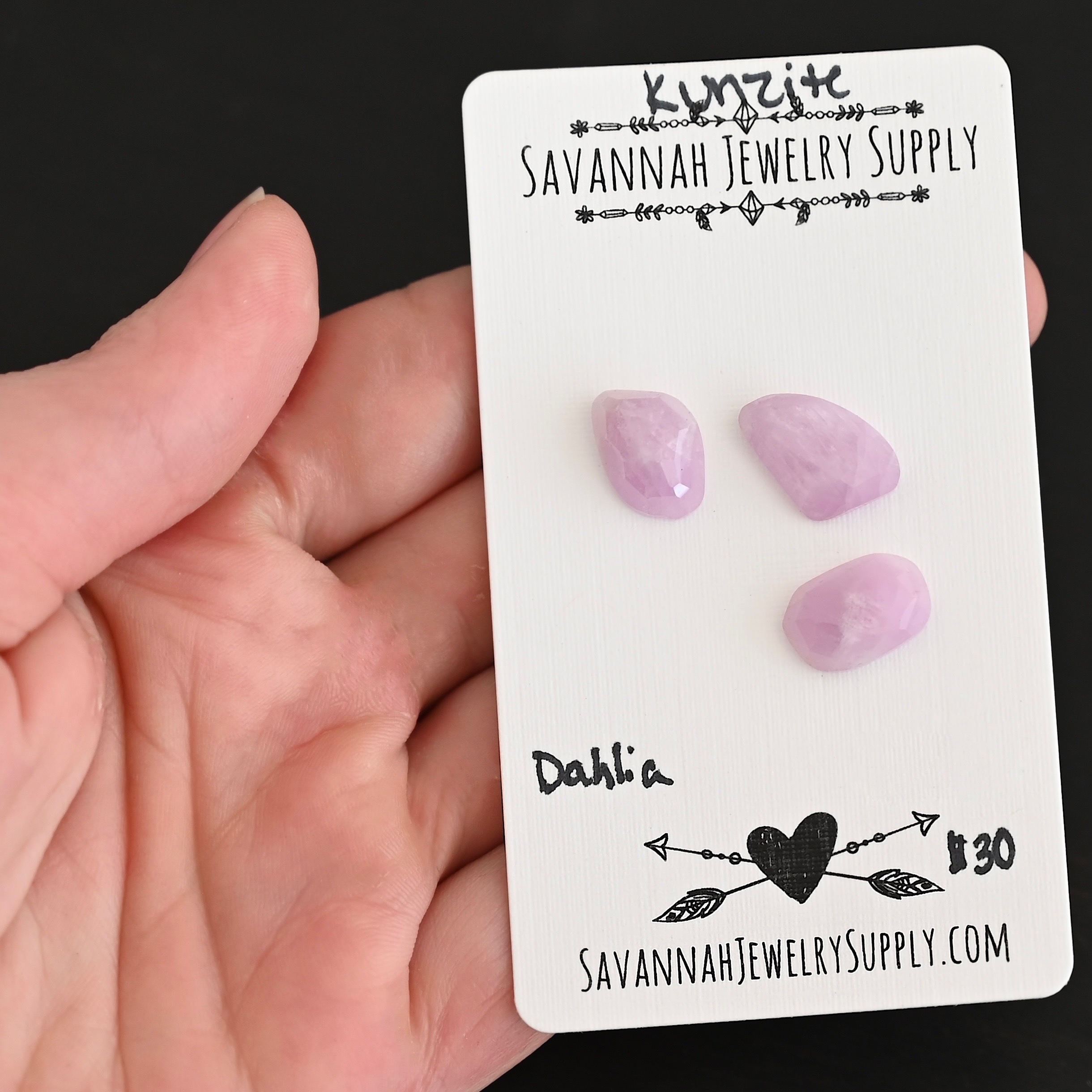 Dahlia Rose Cut Kunzite Cabochon Parcel shown in hand