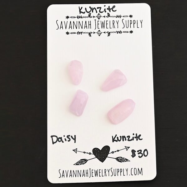 Daisy Rose Cut Kunzite Cabochon Parcel shown on business card