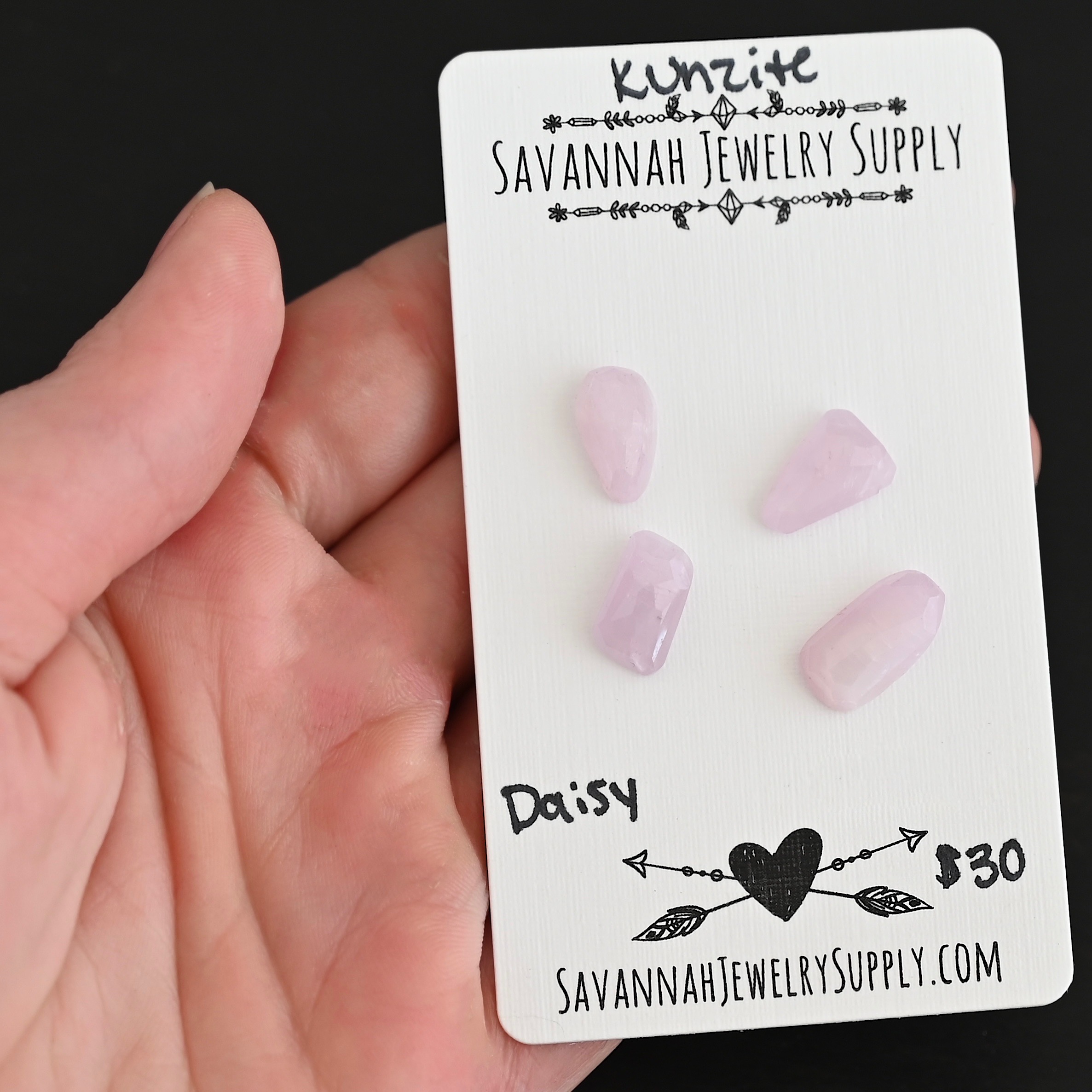 Daisy Rose Cut Kunzite Cabochon Parcel shown in hand