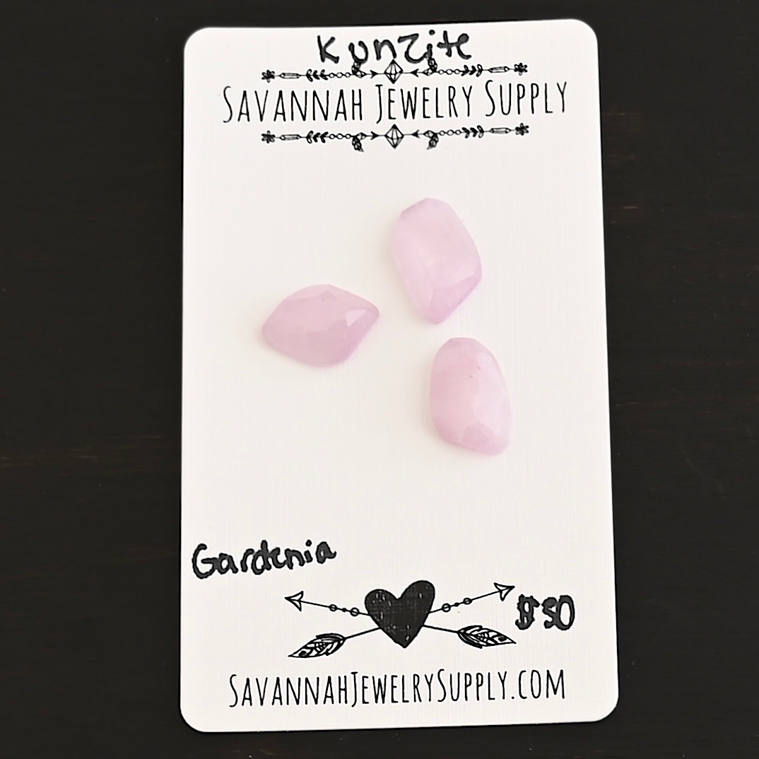 Gardenia Rose Cut Kunzite Cabochon Parcel shown on business card