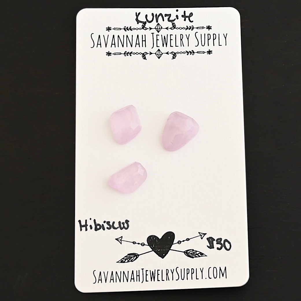 Hibiscus Rose Cut Kunzite Cabochon Parcel shown on business card