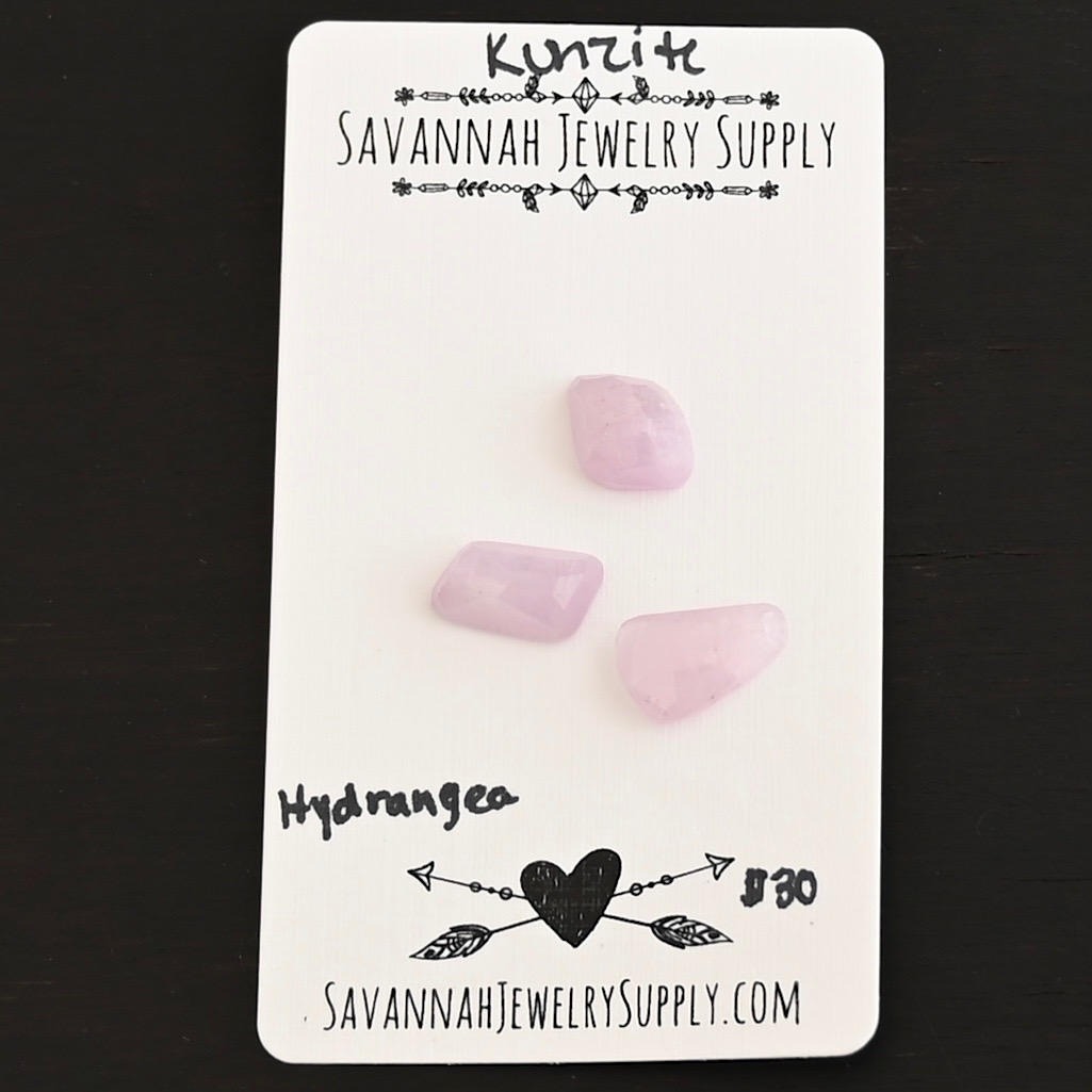 Hydrangea Rose Cut Kunzite Cabochon Parcel shown on business card