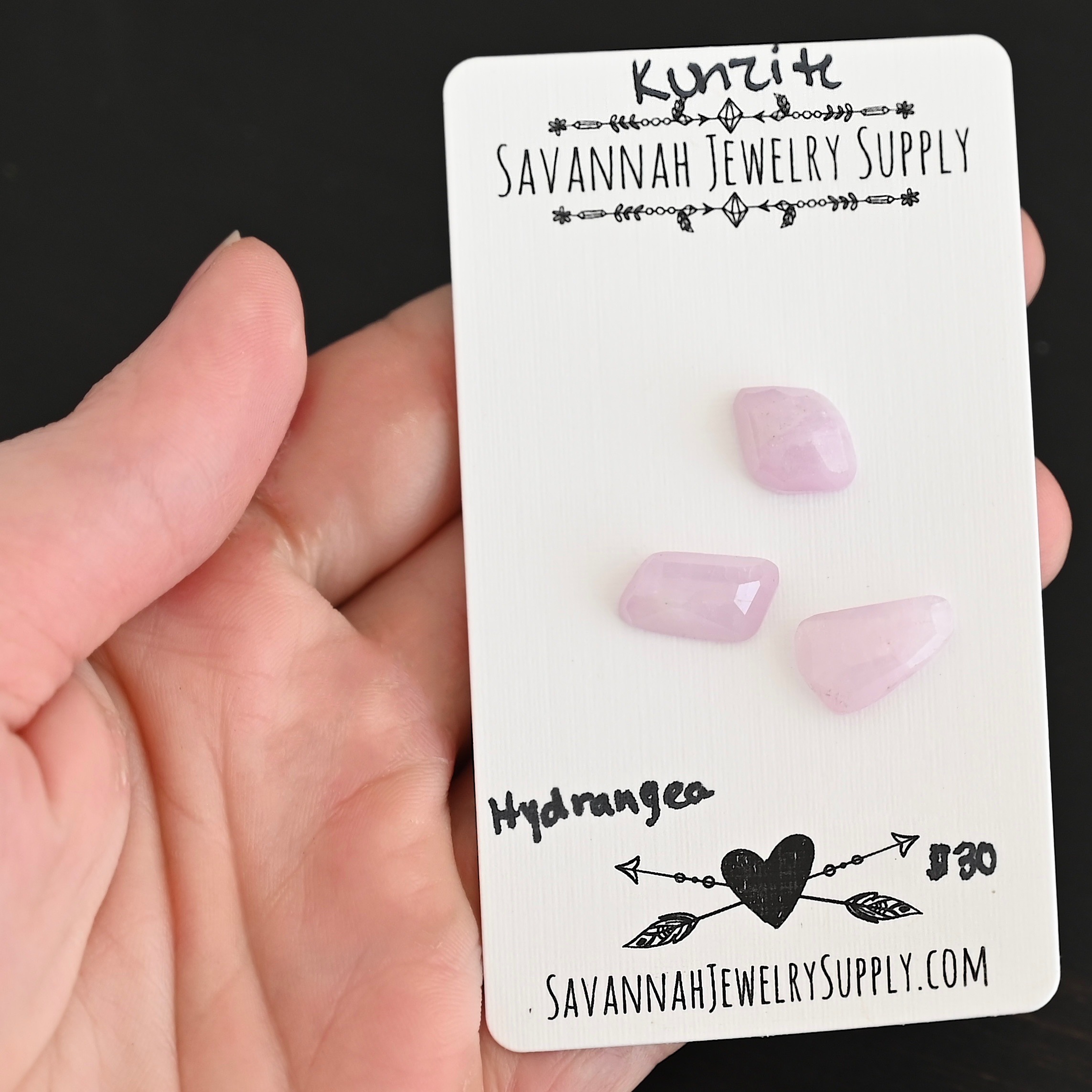 Hydrangea Rose Cut Kunzite Cabochon Parcel shown in hand