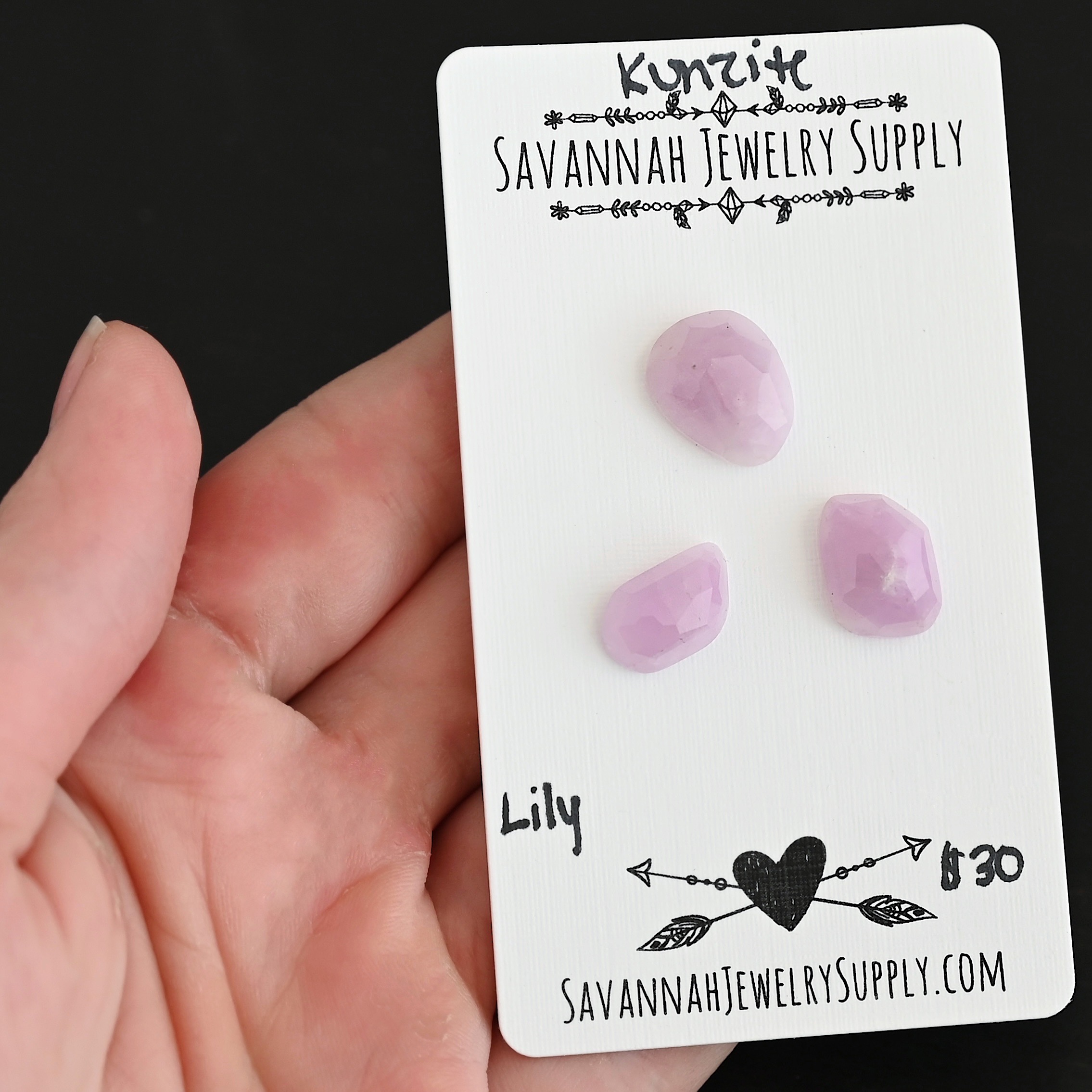 Lily Rose Cut Kunzite Cabochon Parcel shown in hand