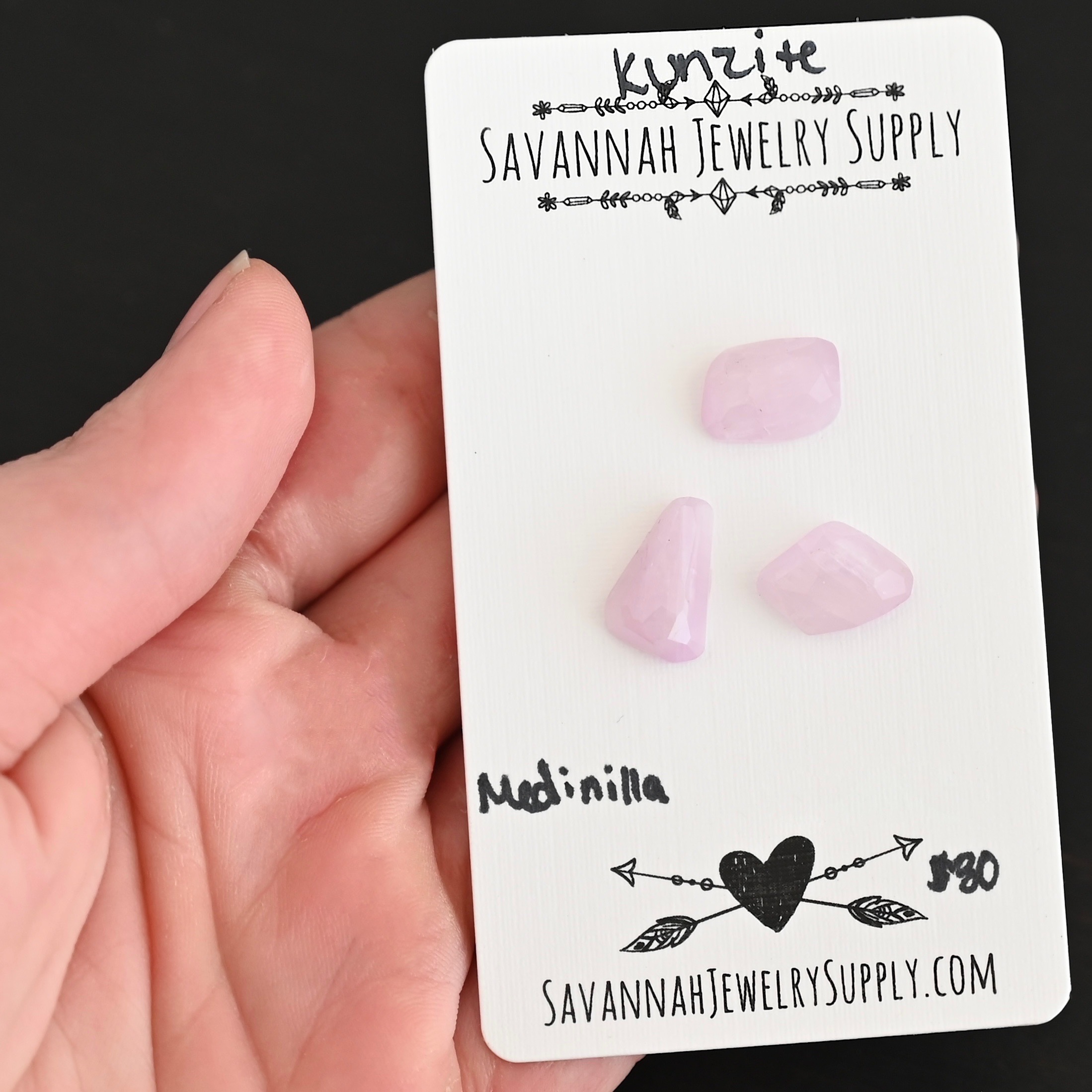 Medinilla Rose Cut Kunzite Cabochon Parcel shown in hand