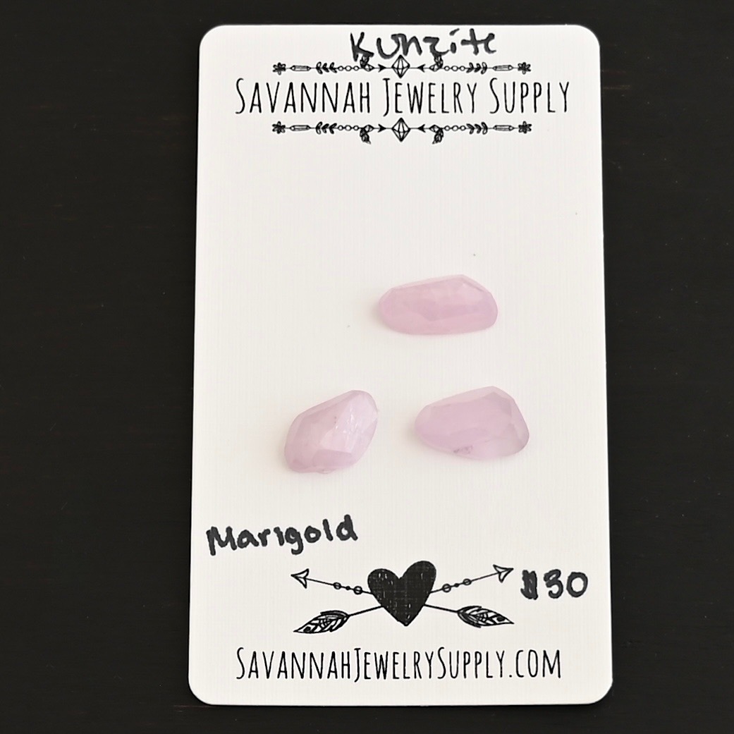 Marigold Rose Cut Kunzite Cabochon Parcel shown on business card