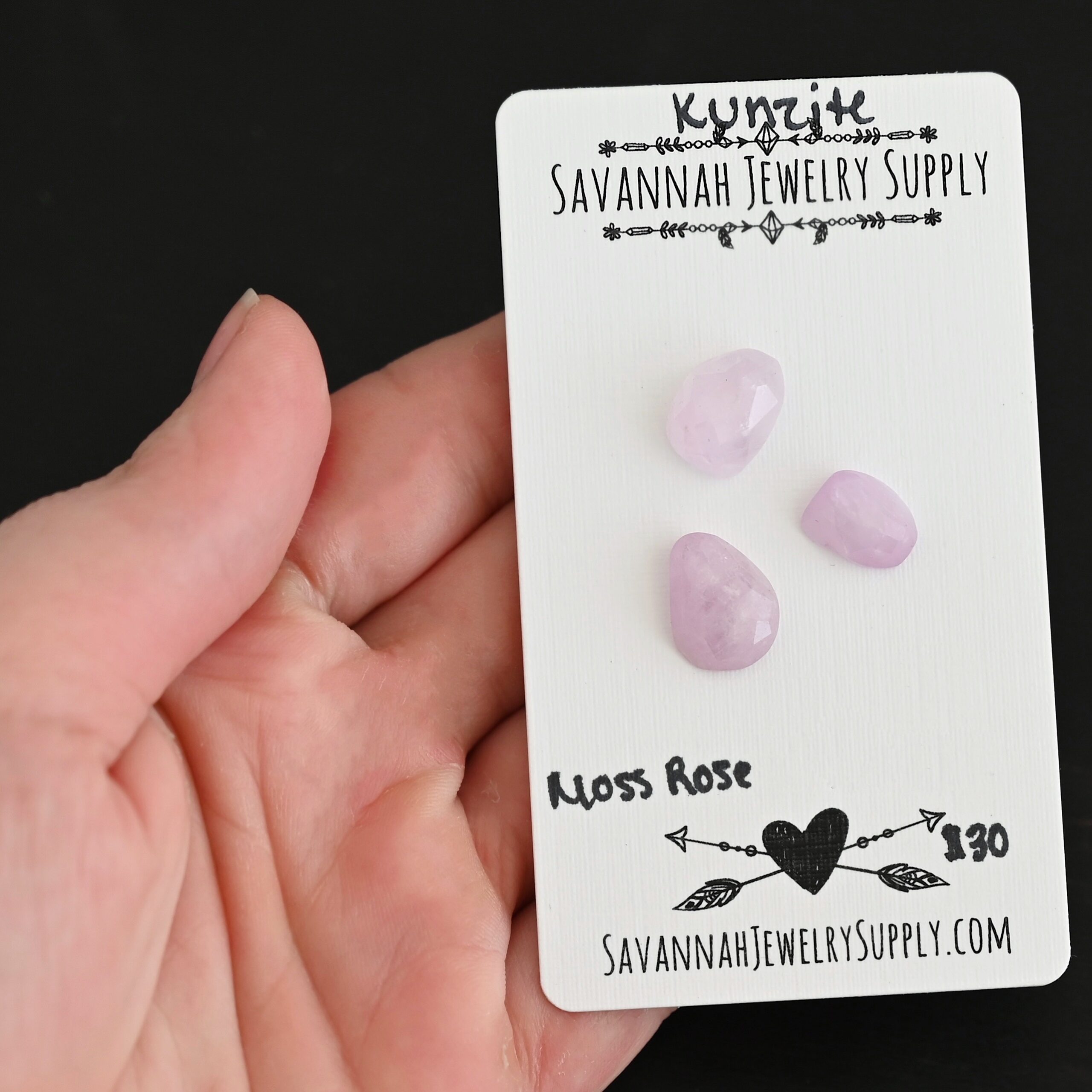 Moss Rose Rose Cut Kunzite Cabochon Parcel shown in hand