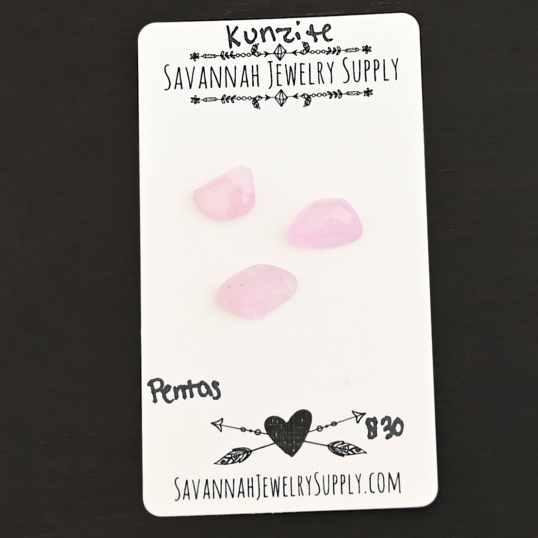 Pentas Rose Cut Kunzite Cabochon Parcel shown on business card
