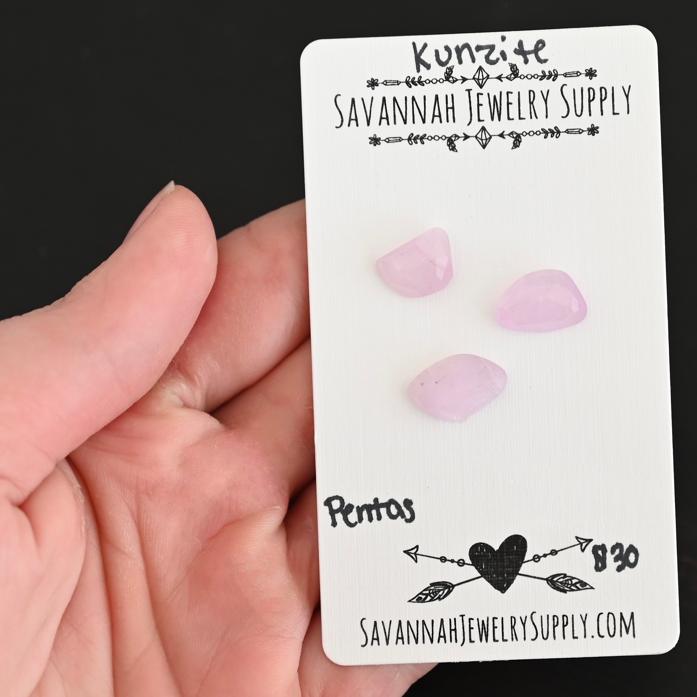 Pentas Rose Cut Kunzite Cabochon Parcel shown in hand