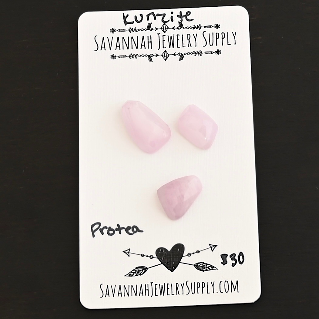 Protea Rose Cut Kunzite Cabochon Parcel shown on business card