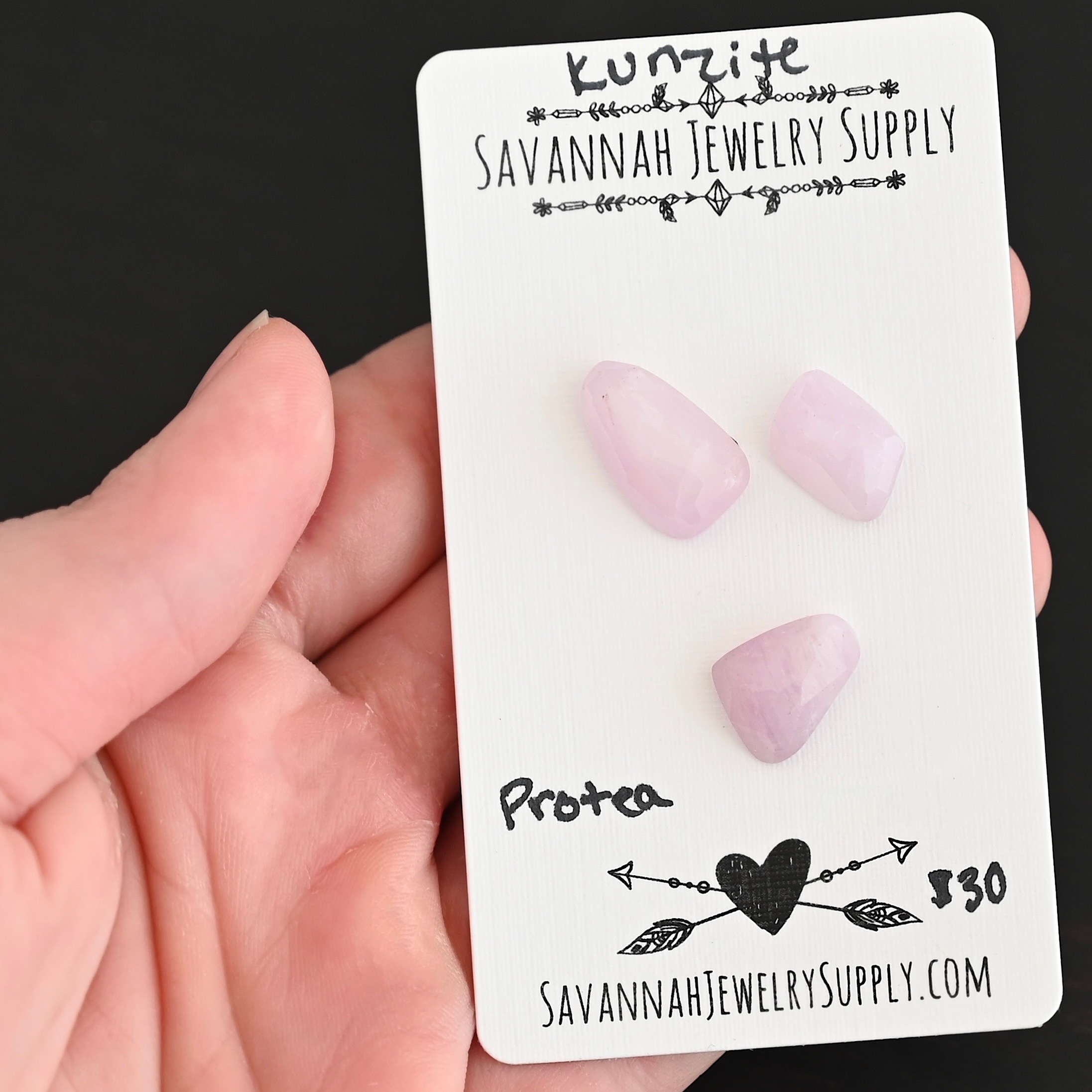 Protea Rose Cut Kunzite Cabochon Parcel shown in hand