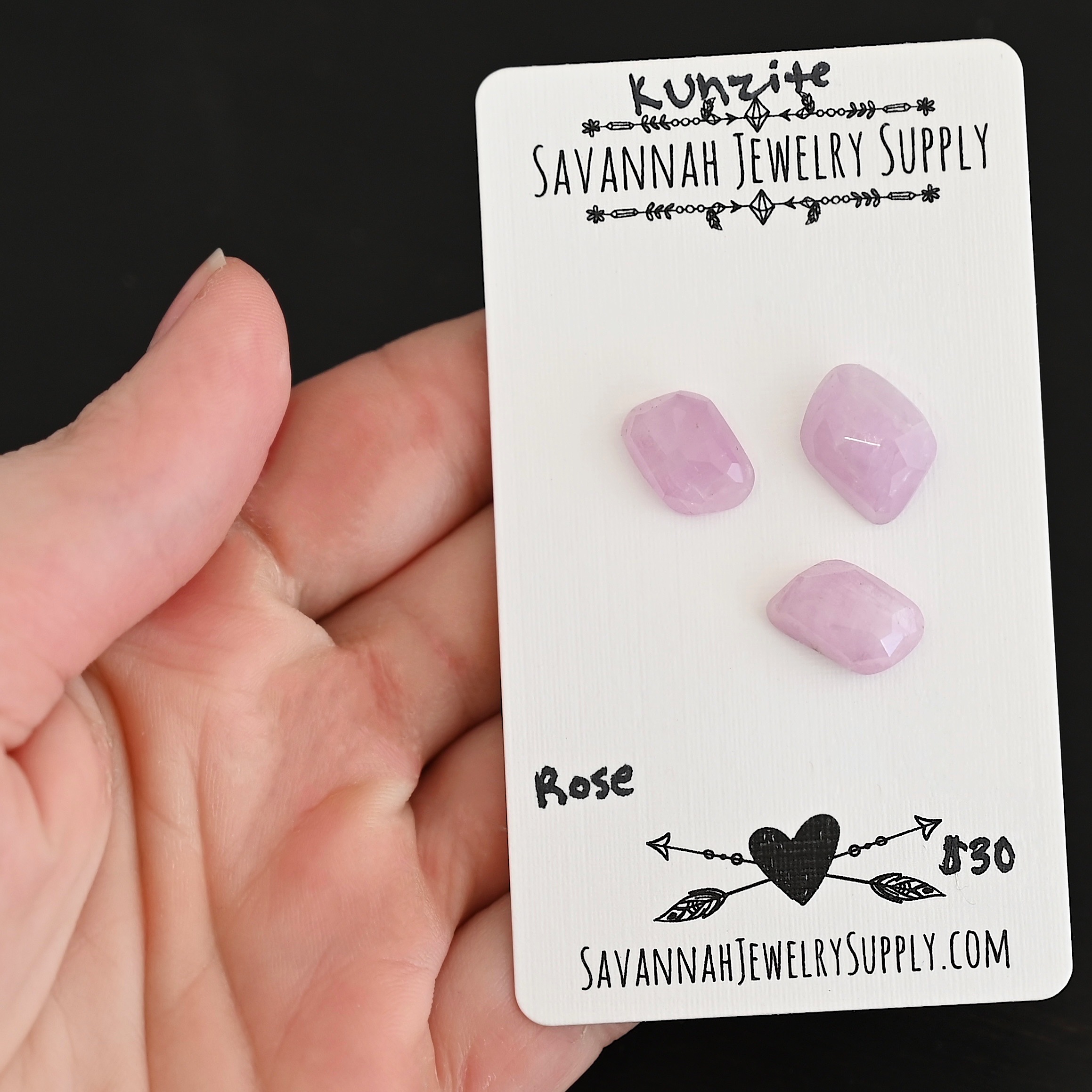 Rose Rose Cut Kunzite Cabochon Parcel shown in hand