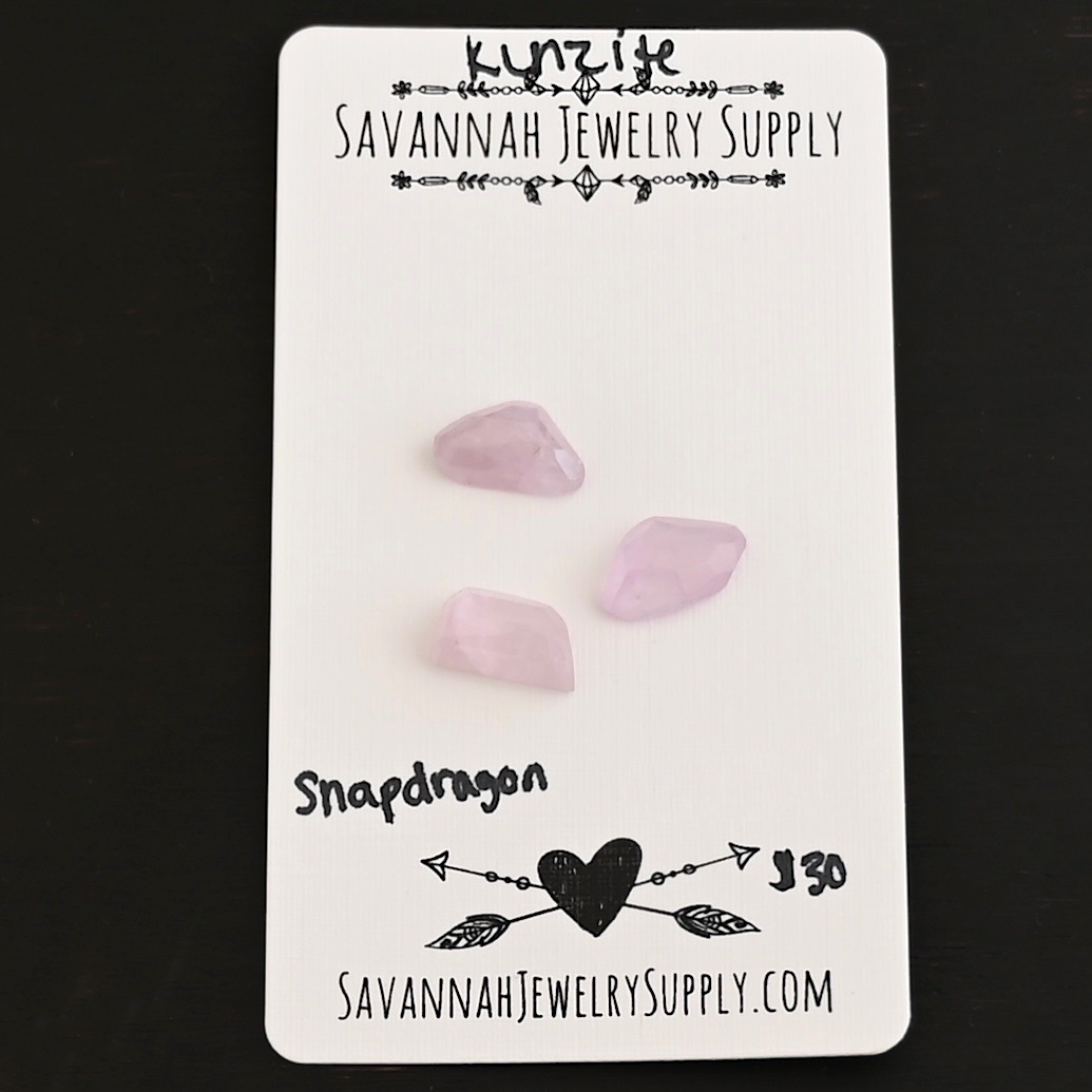 Snapdragon Rose Cut Kunzite Cabochon Parcel shown on business card