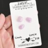 Zinnia Rose Cut Kunzite Cabochon Parcel shown in hand