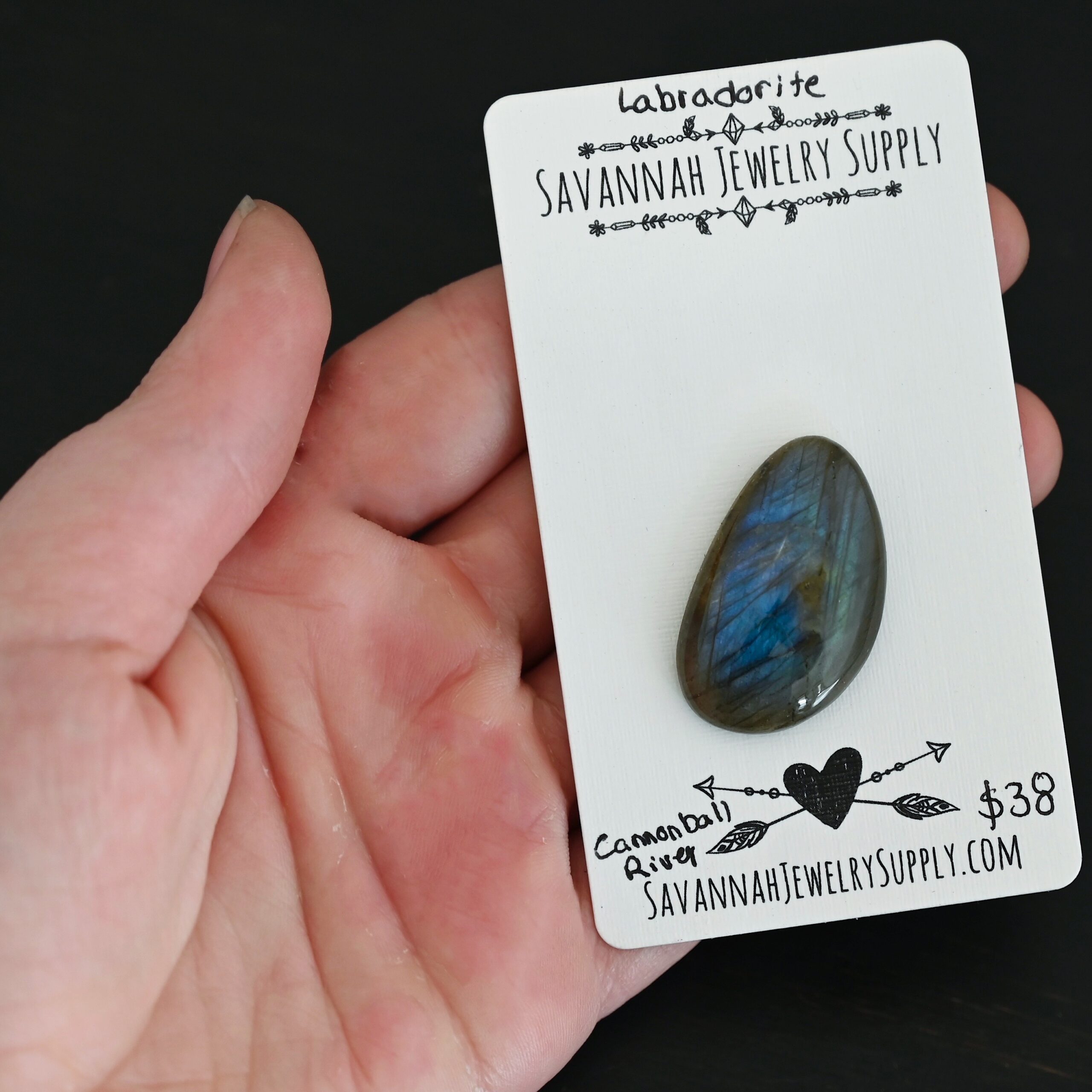 Cannonball River Labradorite Cabochon Parcel shown in hand