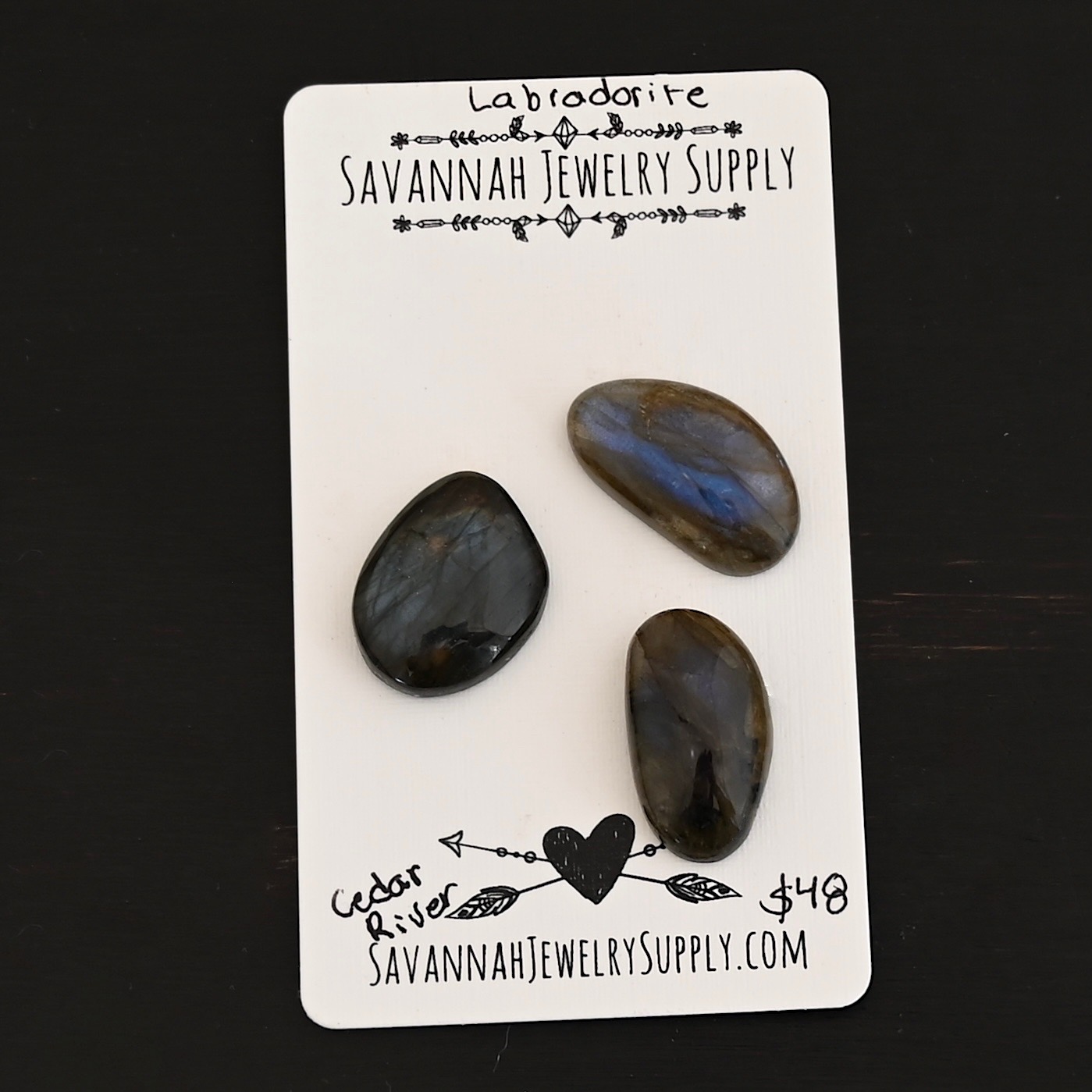 Cedar River Labradorite Cabochon Parcel shown on business card