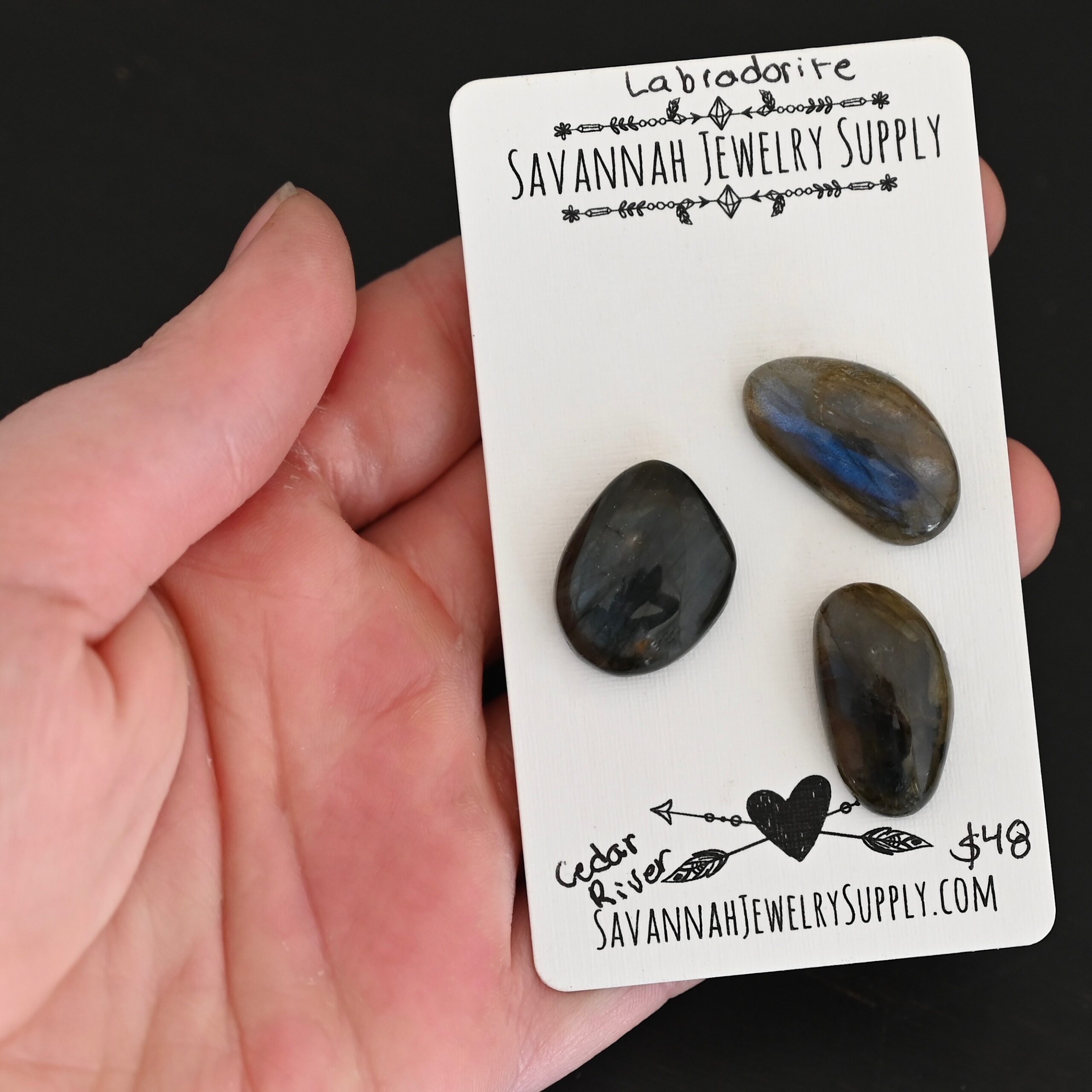 Cedar River Labradorite Cabochon Parcel shown in hand