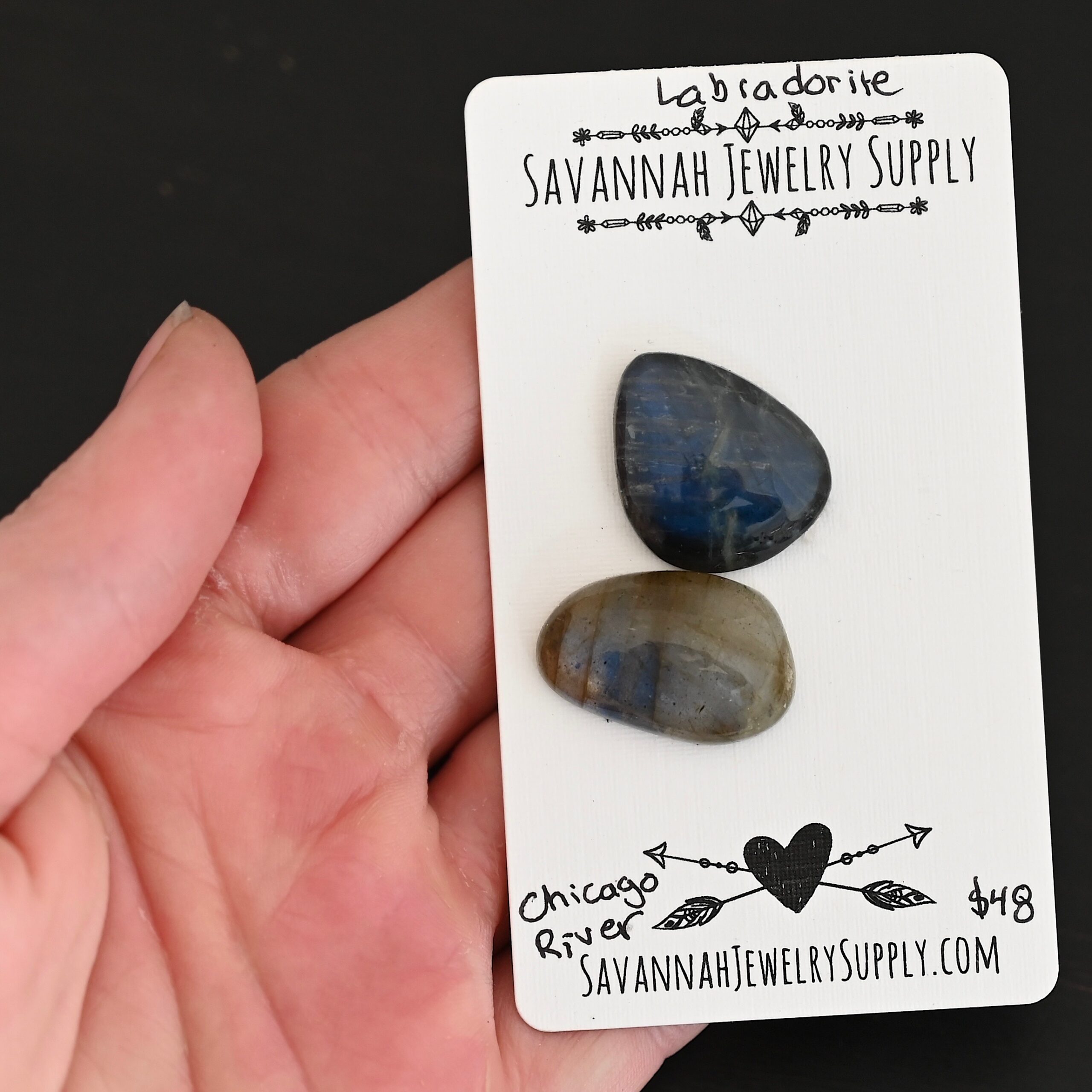 Chicago River Labradorite Cabochon Parcel shown in hand