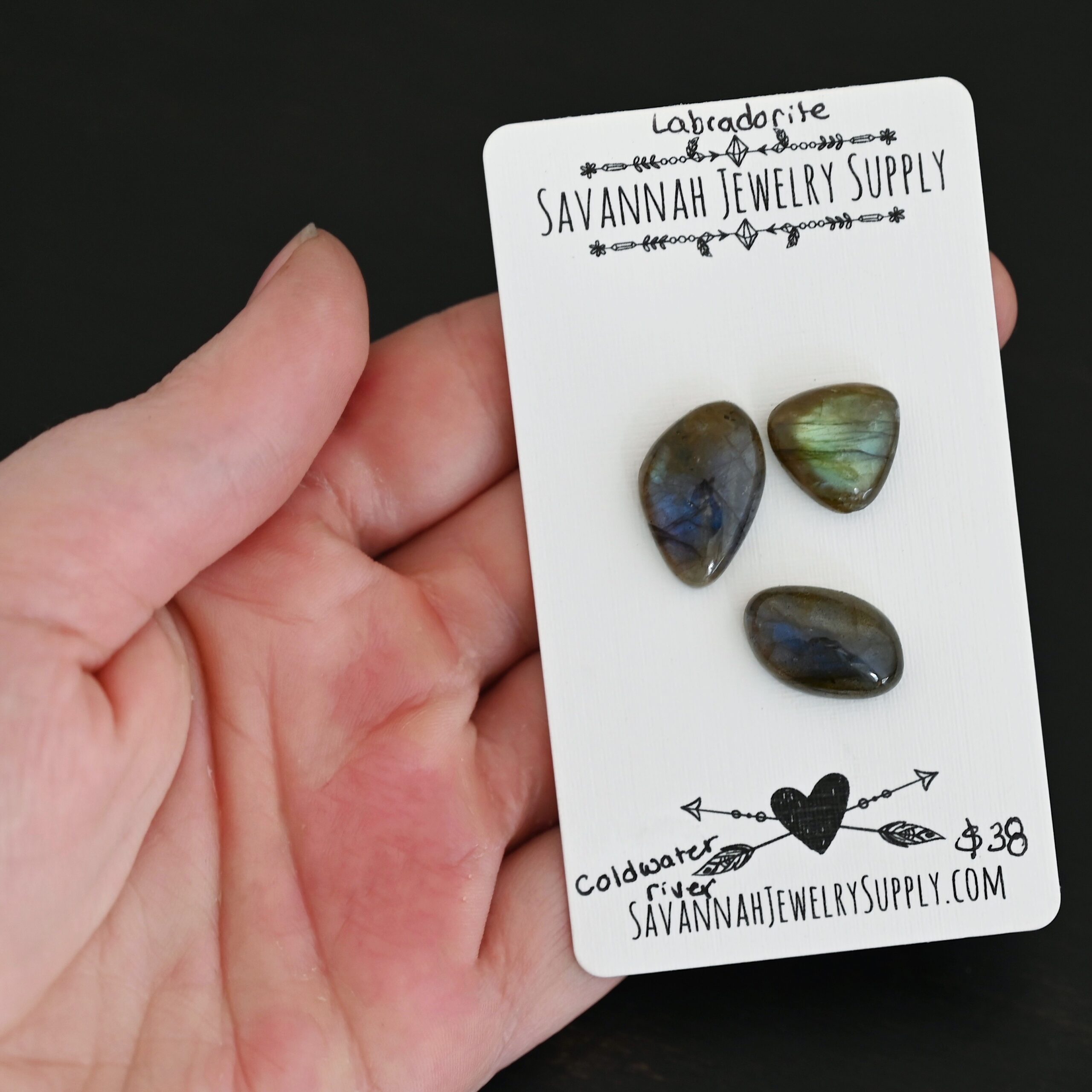 Coldwater River Labradorite Cabochon Parcel shown in hand